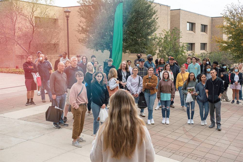 A group of potential students on a tour of campus.