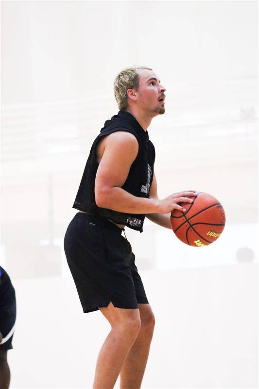 participant for basketball intramurals setting up to shoot a shot