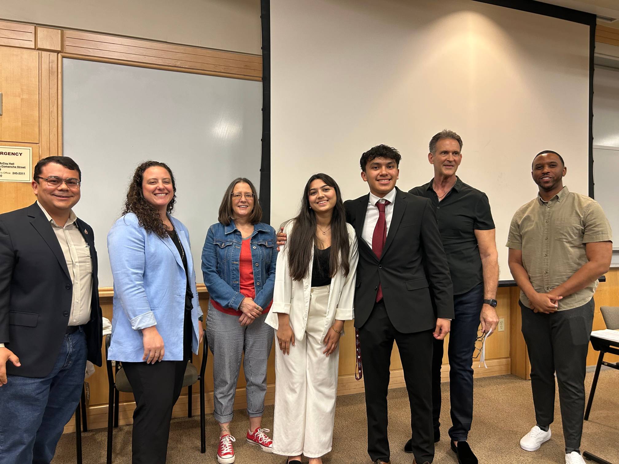 Smiling judges and participants in the Bobcat Innovation Challenge 