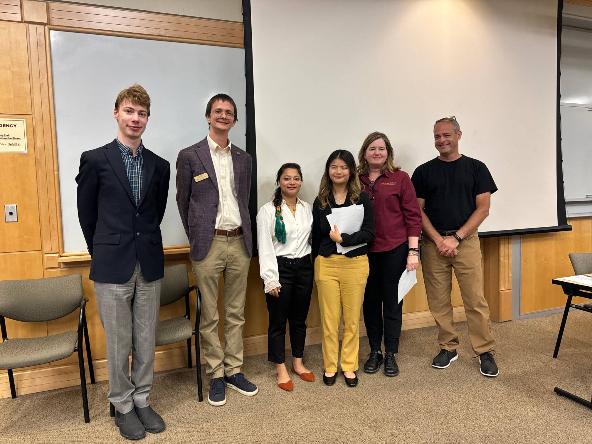 Judges and students smiling at the Bobcat Innovation Challenge 