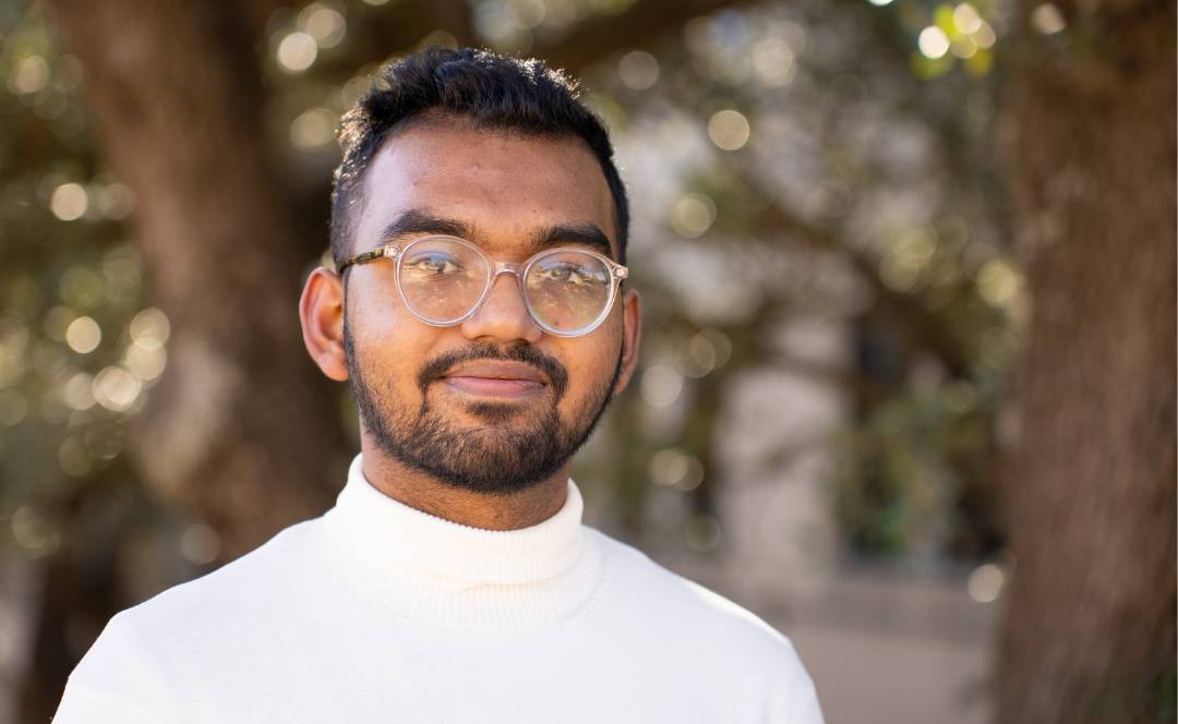 Nibir Showhardo walking around the McCoy College of Business