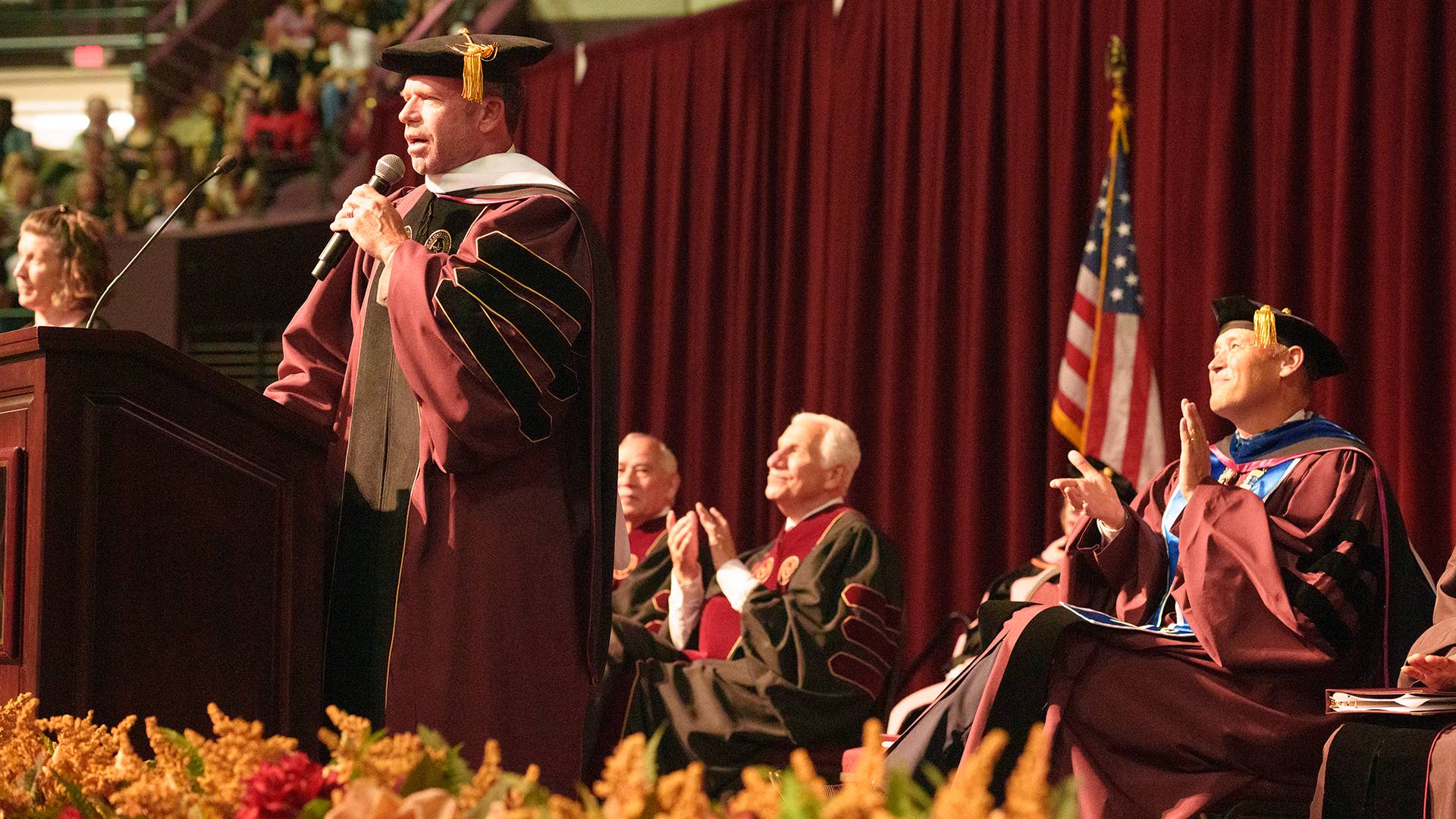 graduates sitting at a commencement ceremony