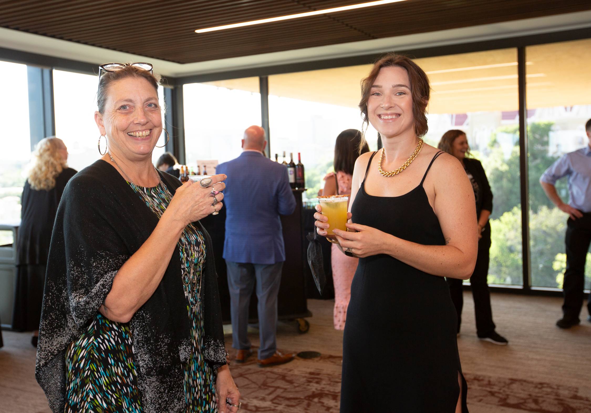 Two women enjoying cocktails