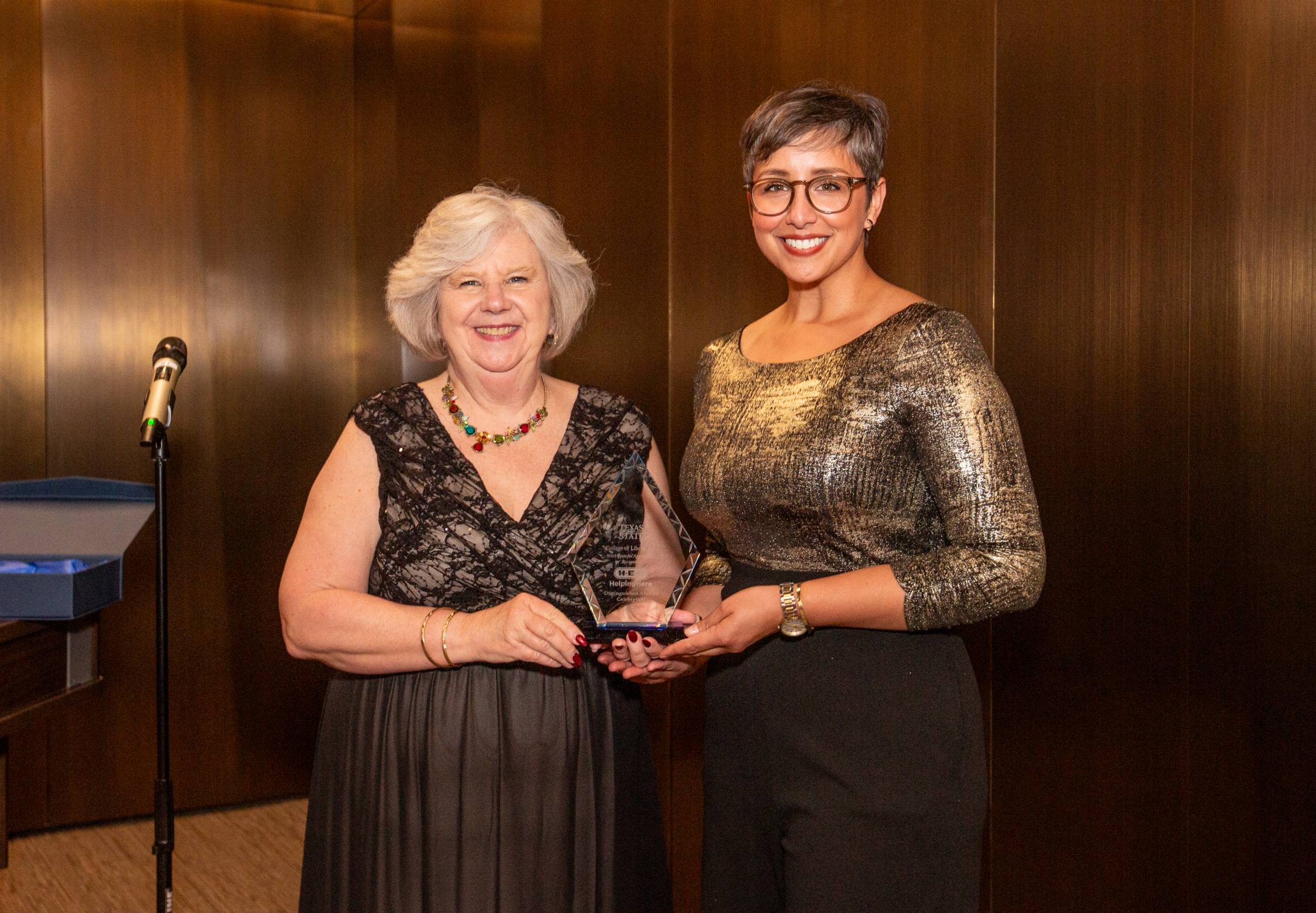 Posed photo with award