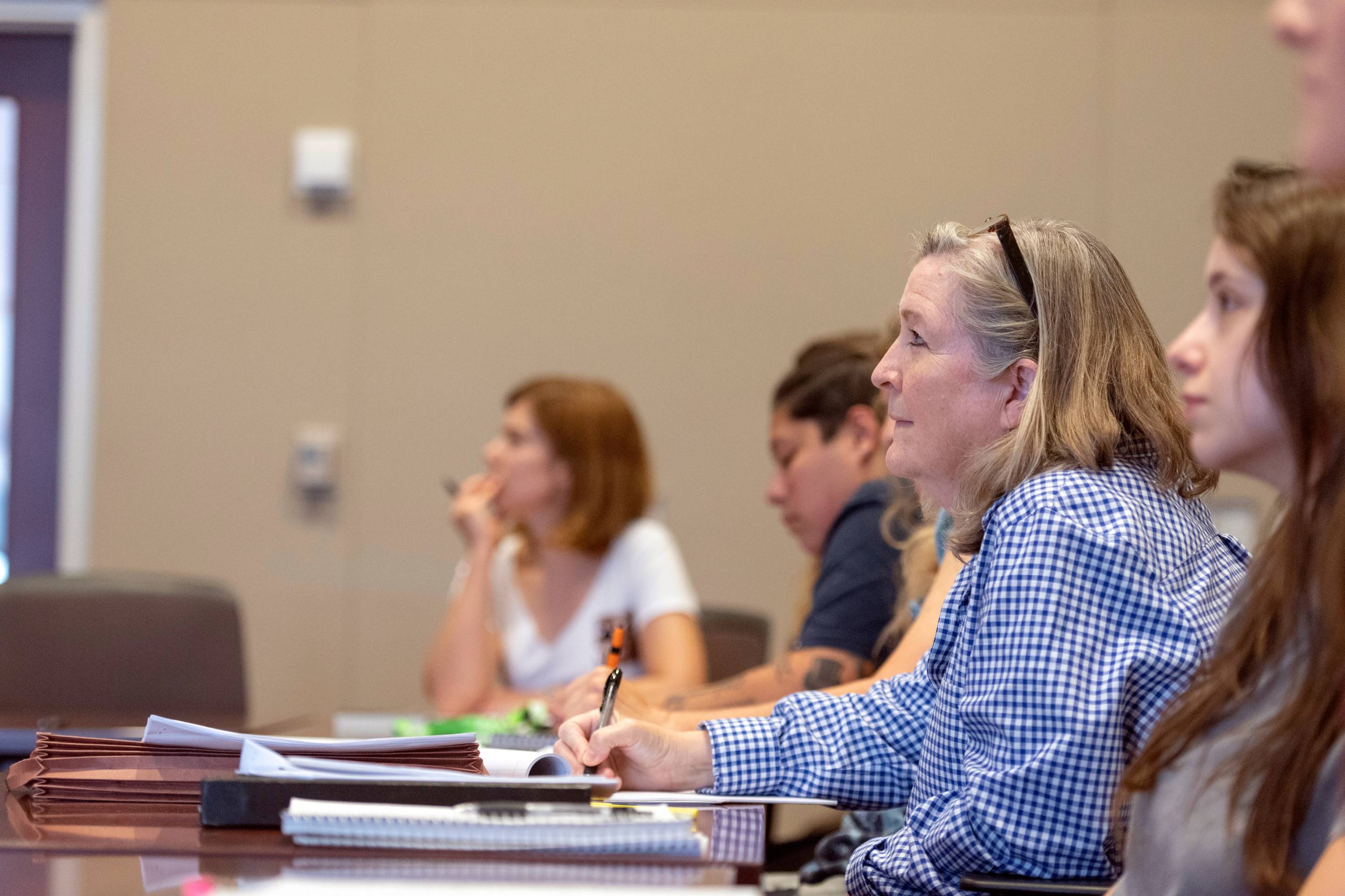 graduate students in a classroom setting