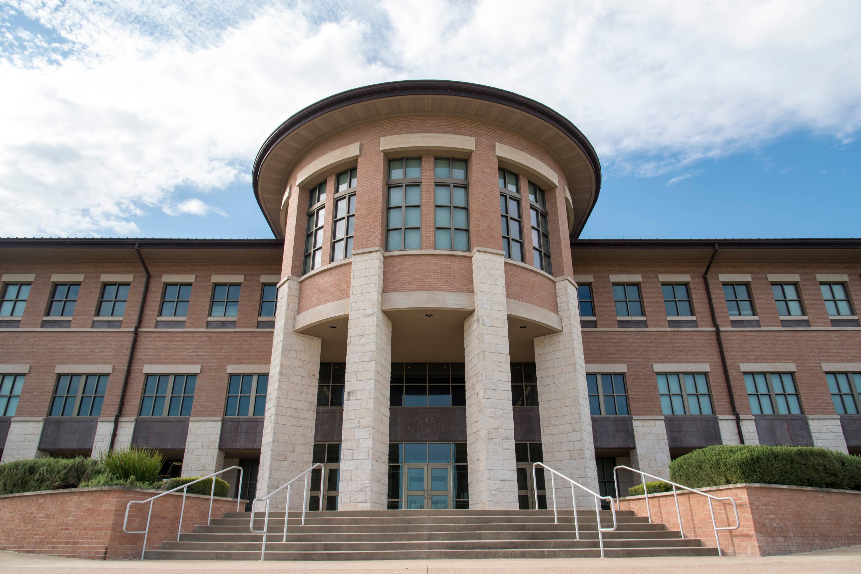 A photograph of Round Rock Campus' Avery Building showing it's entrance stairs.