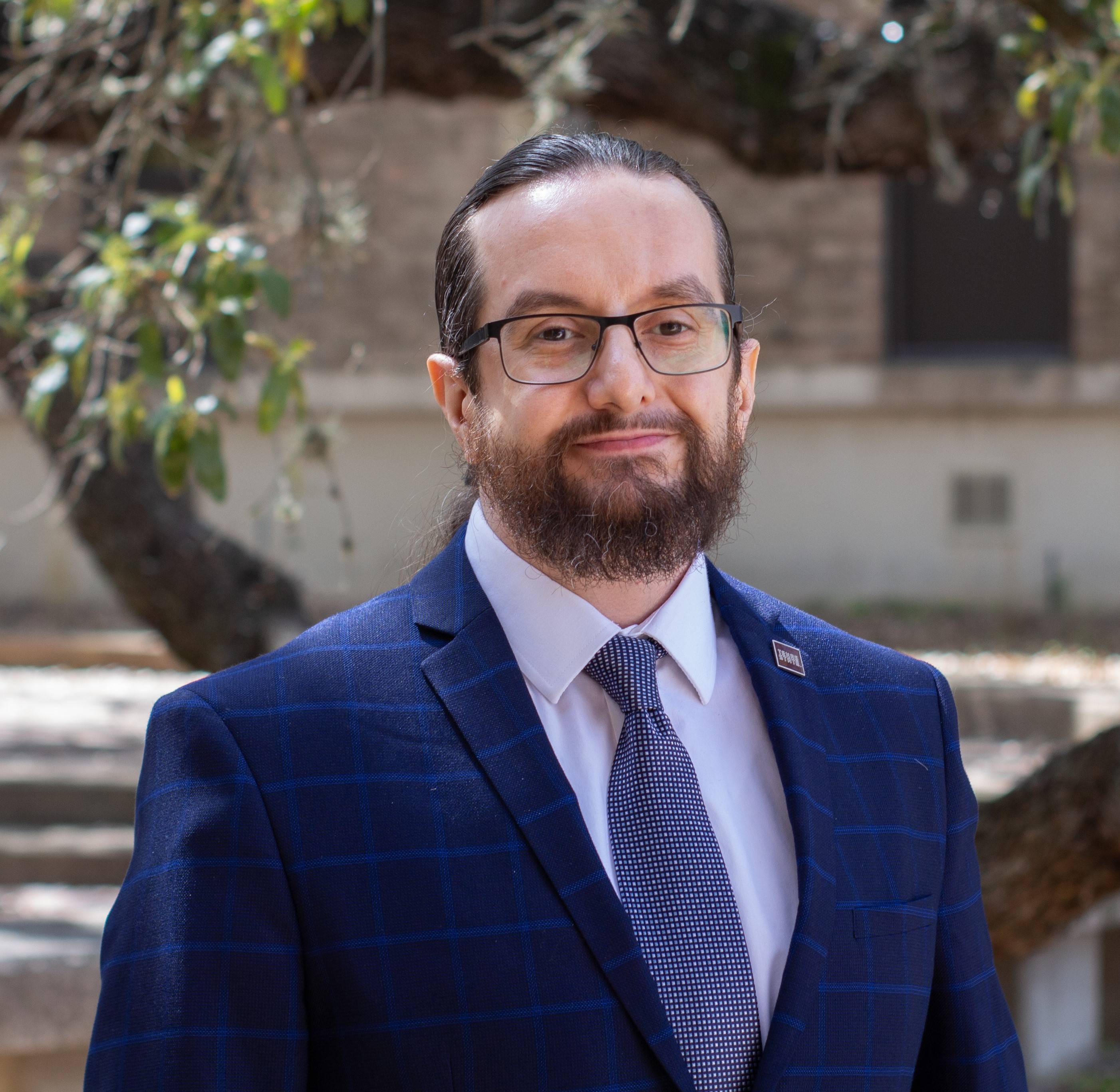 Dr. Nadim Adi