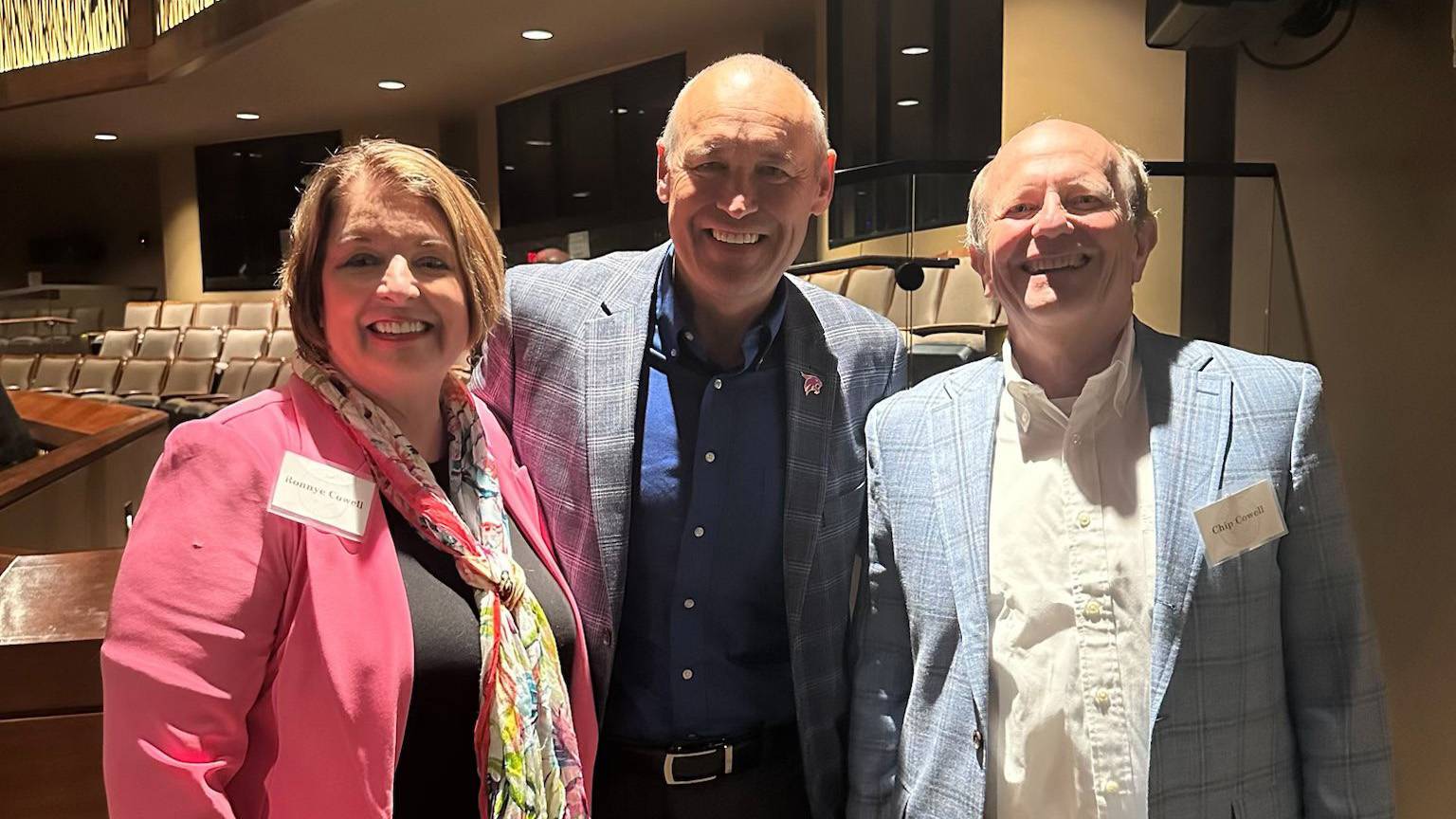President Damphousse (middle) poses for a photo with two President's Associates.