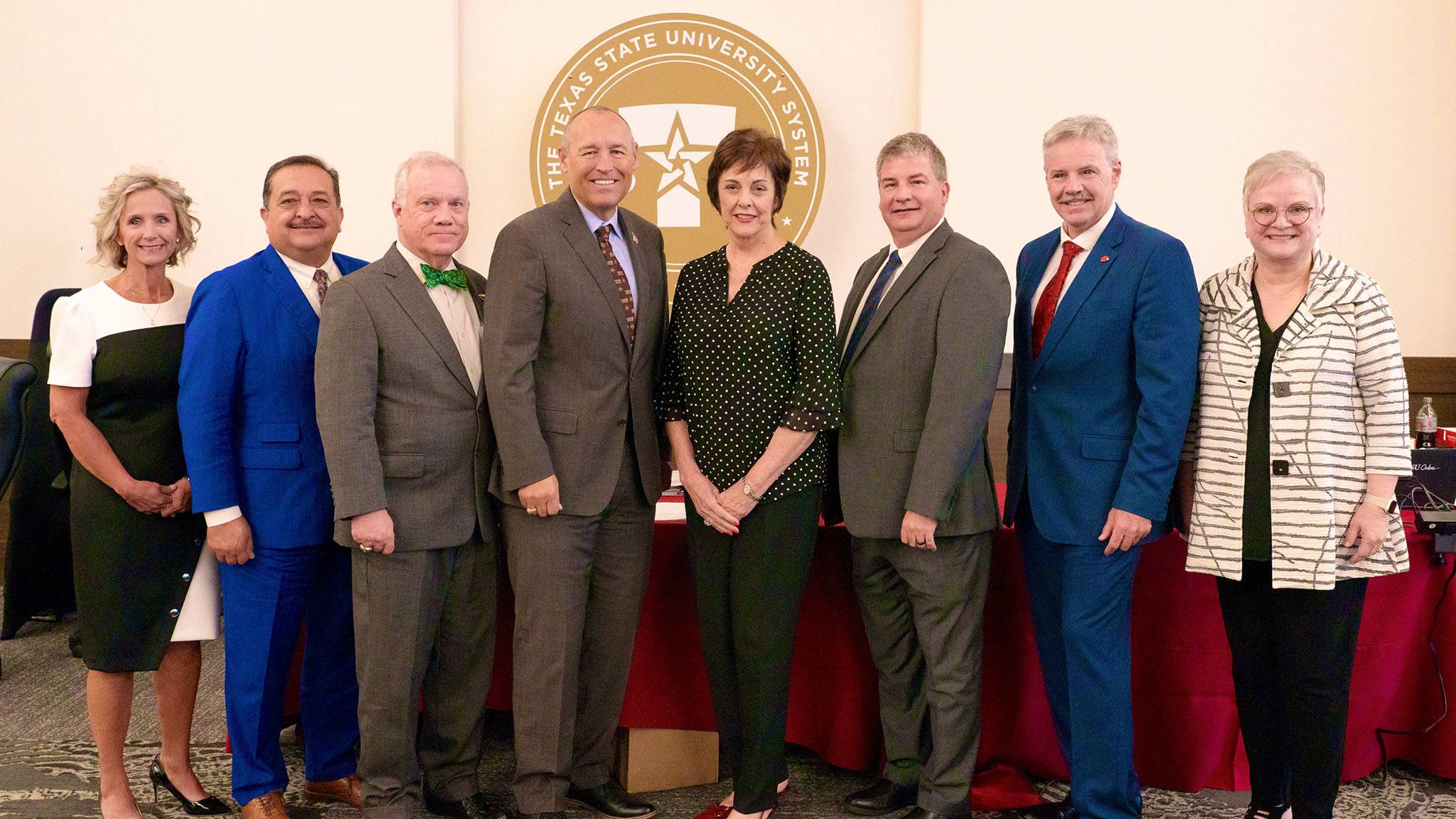 President Damphousse (middle left) poses for a photo with TXST leadership and TSUS board members.