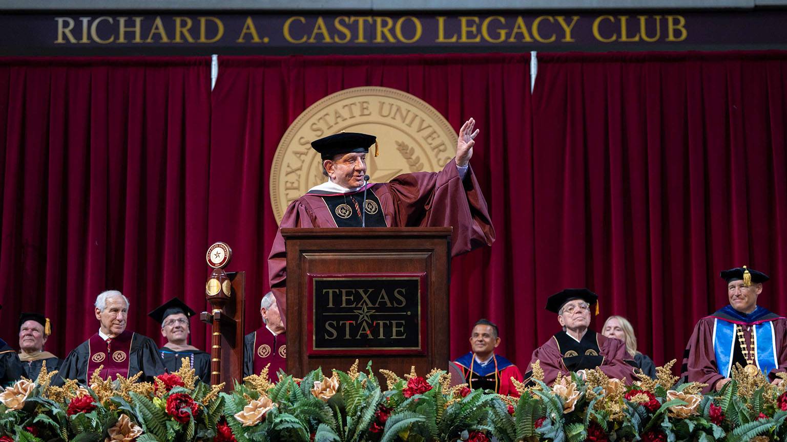 Richard Castro speaks to the audience at a spring commencement ceremony.