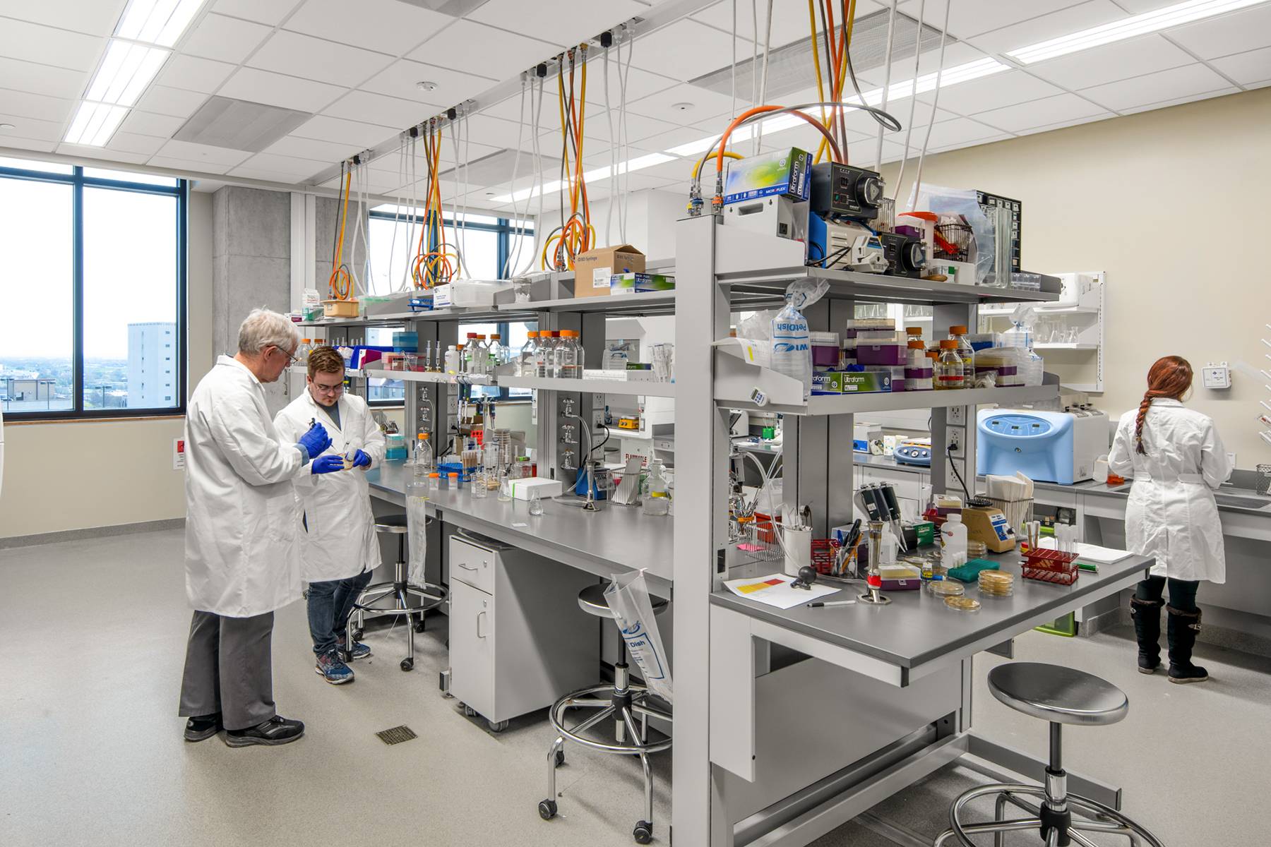 Faculty and student researchers in a lab