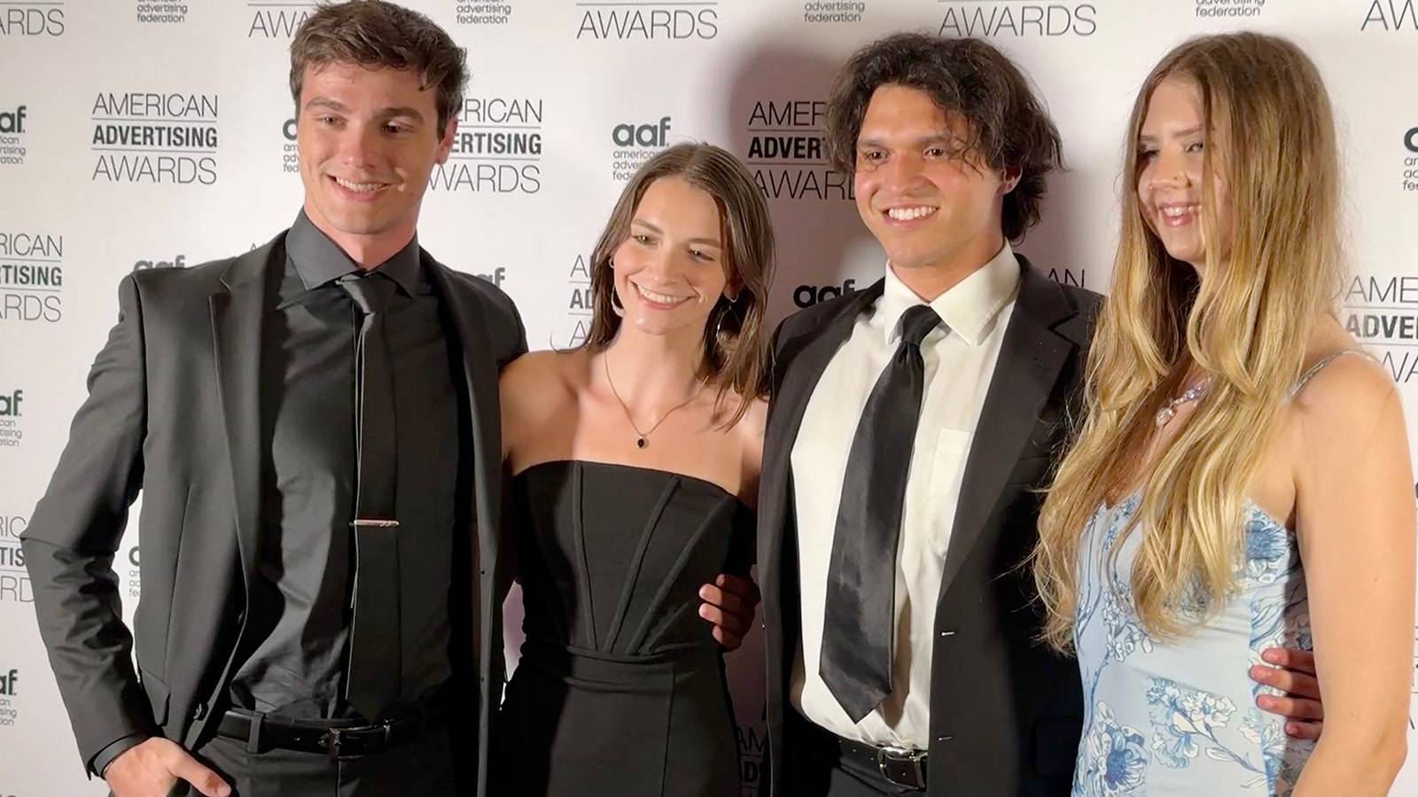 four students pose for photo at National Student Advertising Competition
