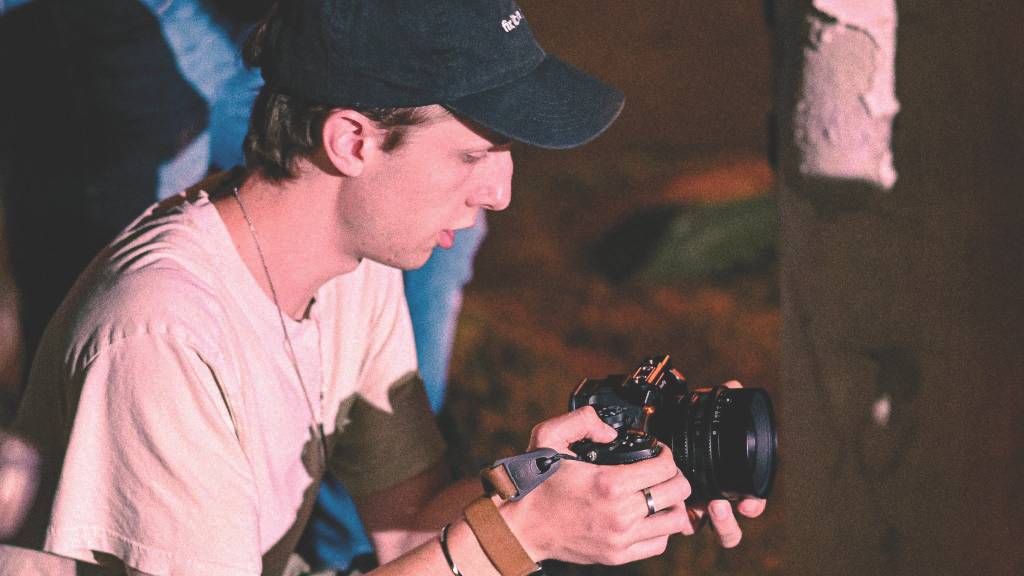 TXST Film Student holding a camera