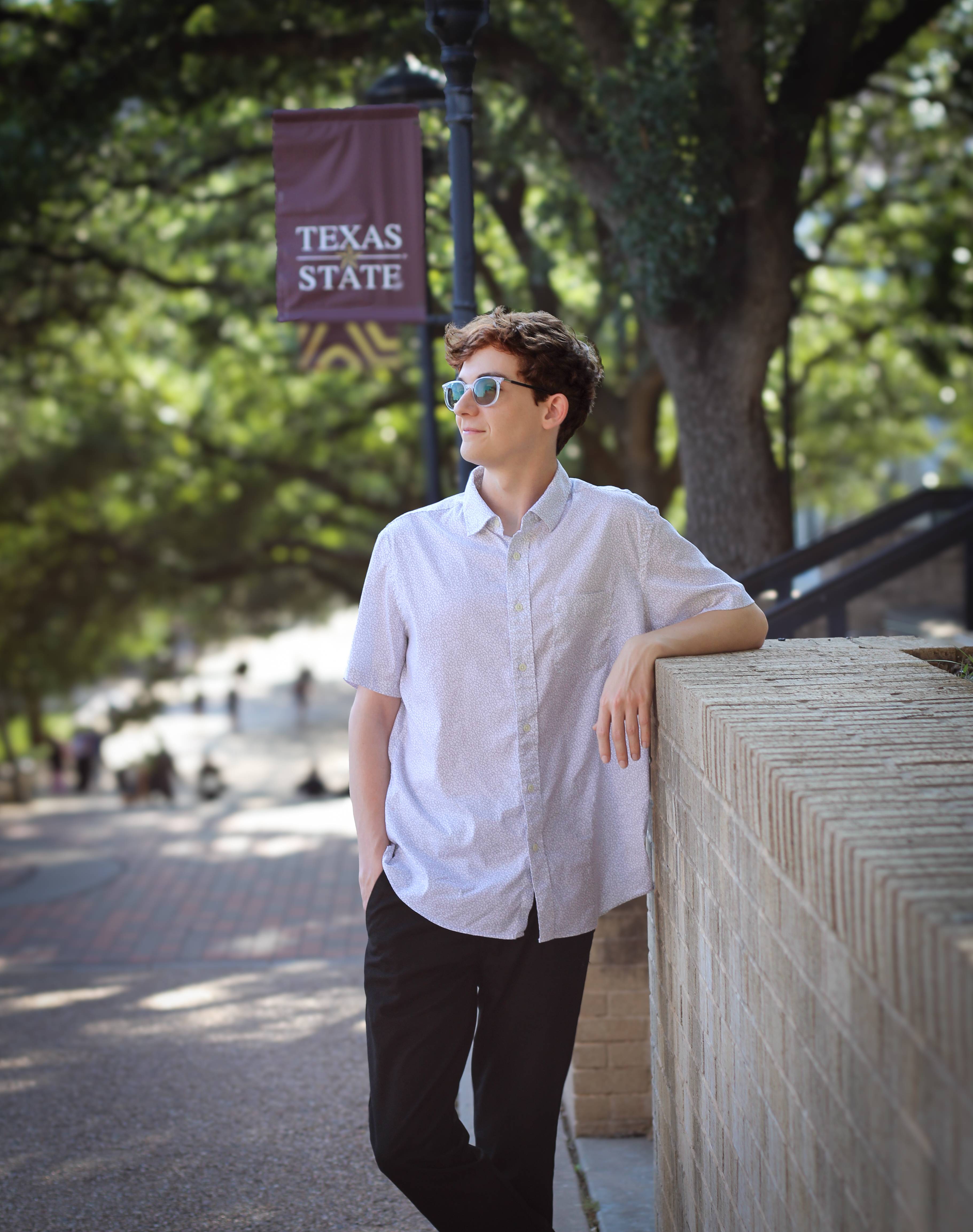 Trace Kleinecke posts for the camera in the Quad.