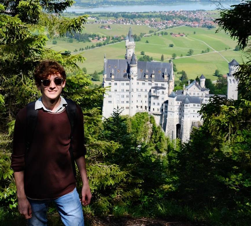 Trace Kleinecke poses in front of Neuschwannstein Castle