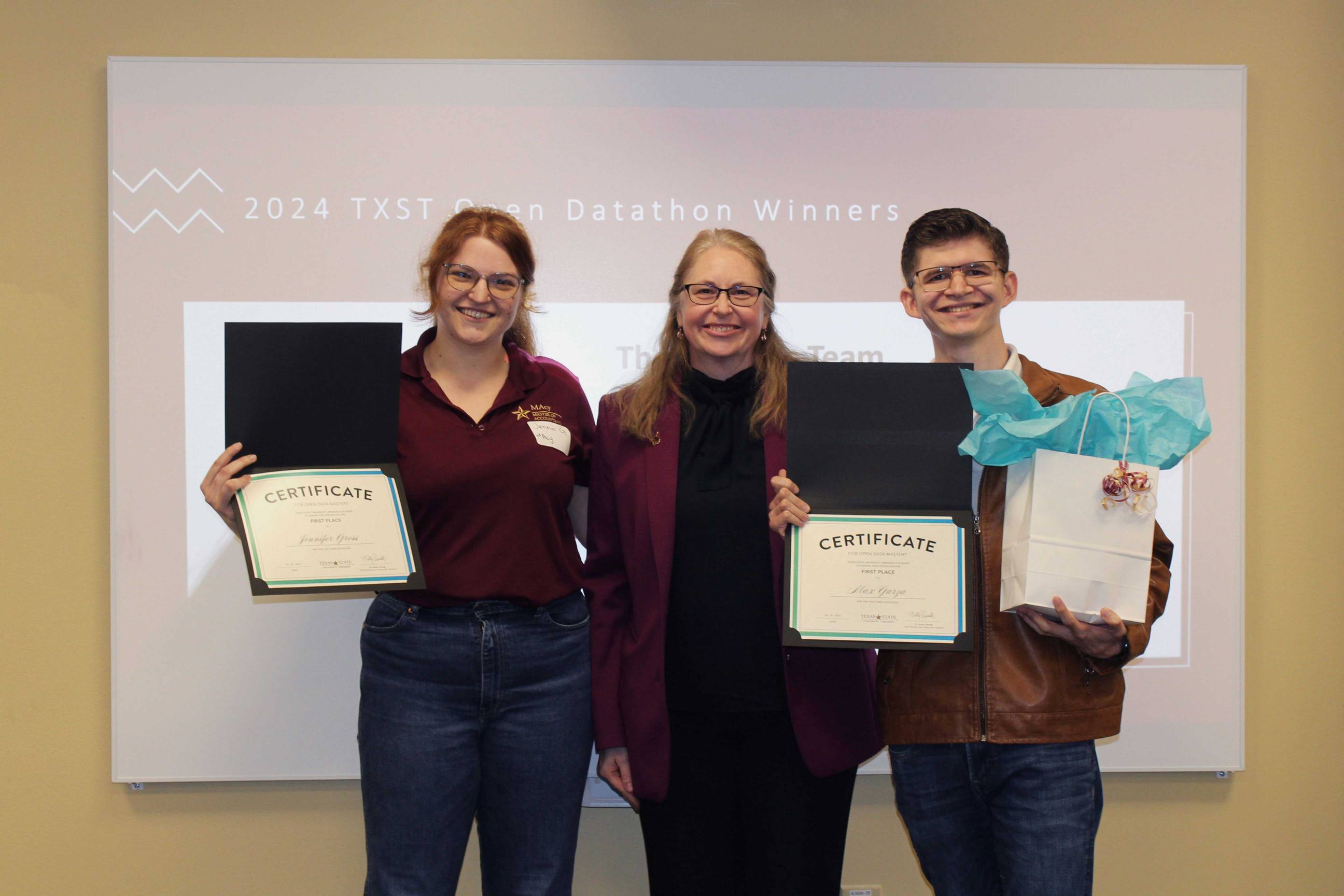 Winning team pictures with library director, Dr. Kelly Visnak