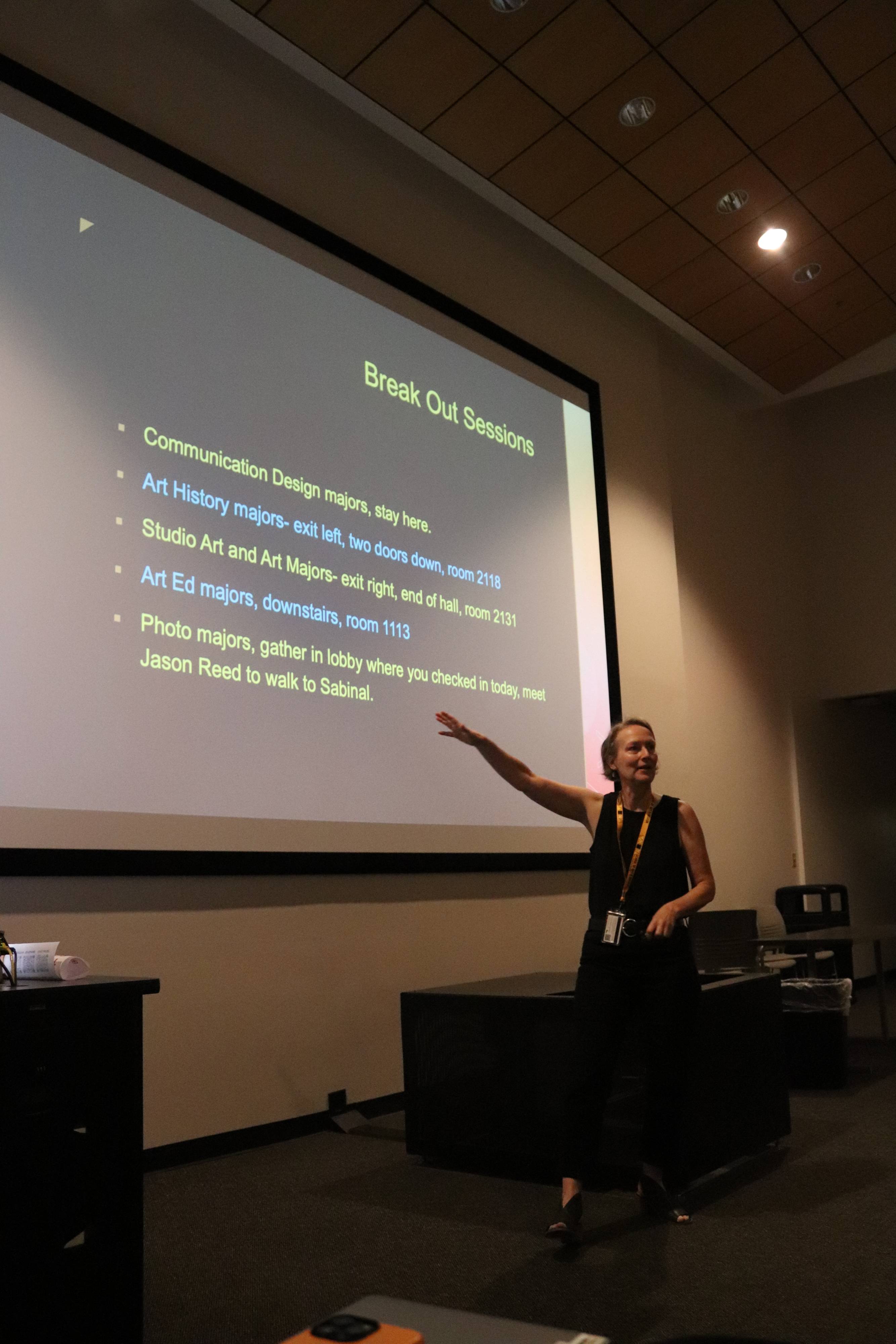A woman pointing at a presentation