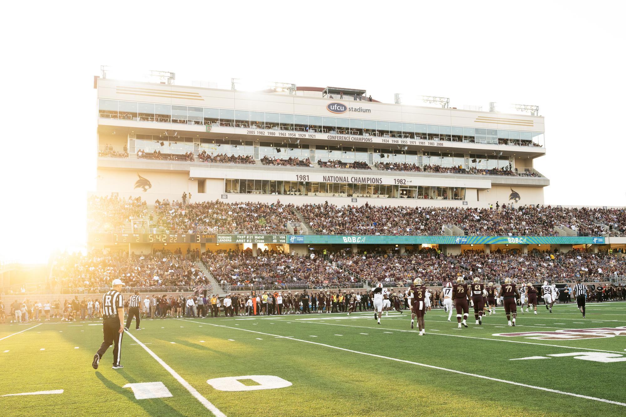 wide photo of UFCU Stadium with large capacity during football game