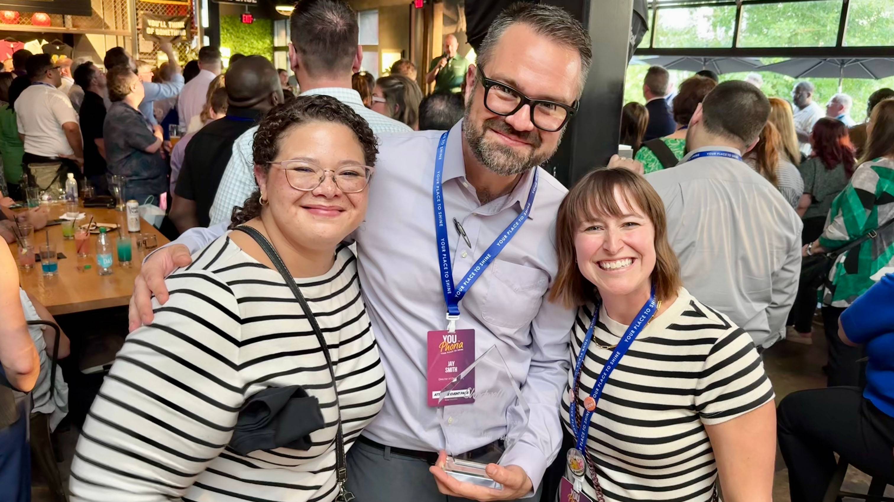 Sarah Williams, Jay Smith, and Whitney Villarreal pose for a photo together at the summit.