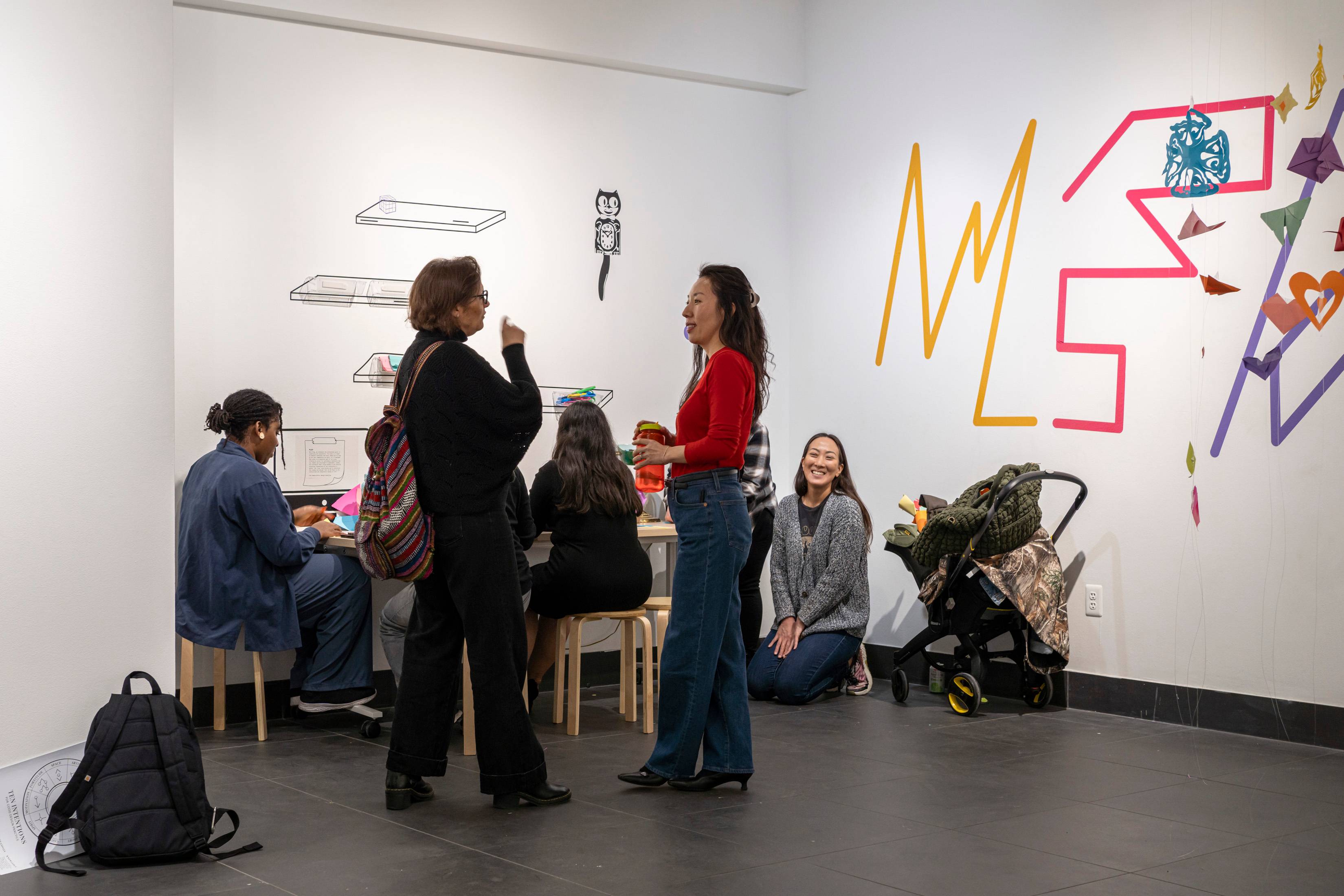 Students gathered in a gallery space