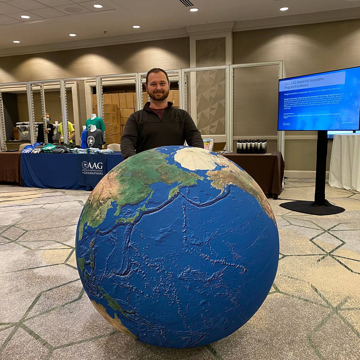 Adam Clark at the 2023 Annual Meeting of the American Association of Geographers in Denver, Colorado.