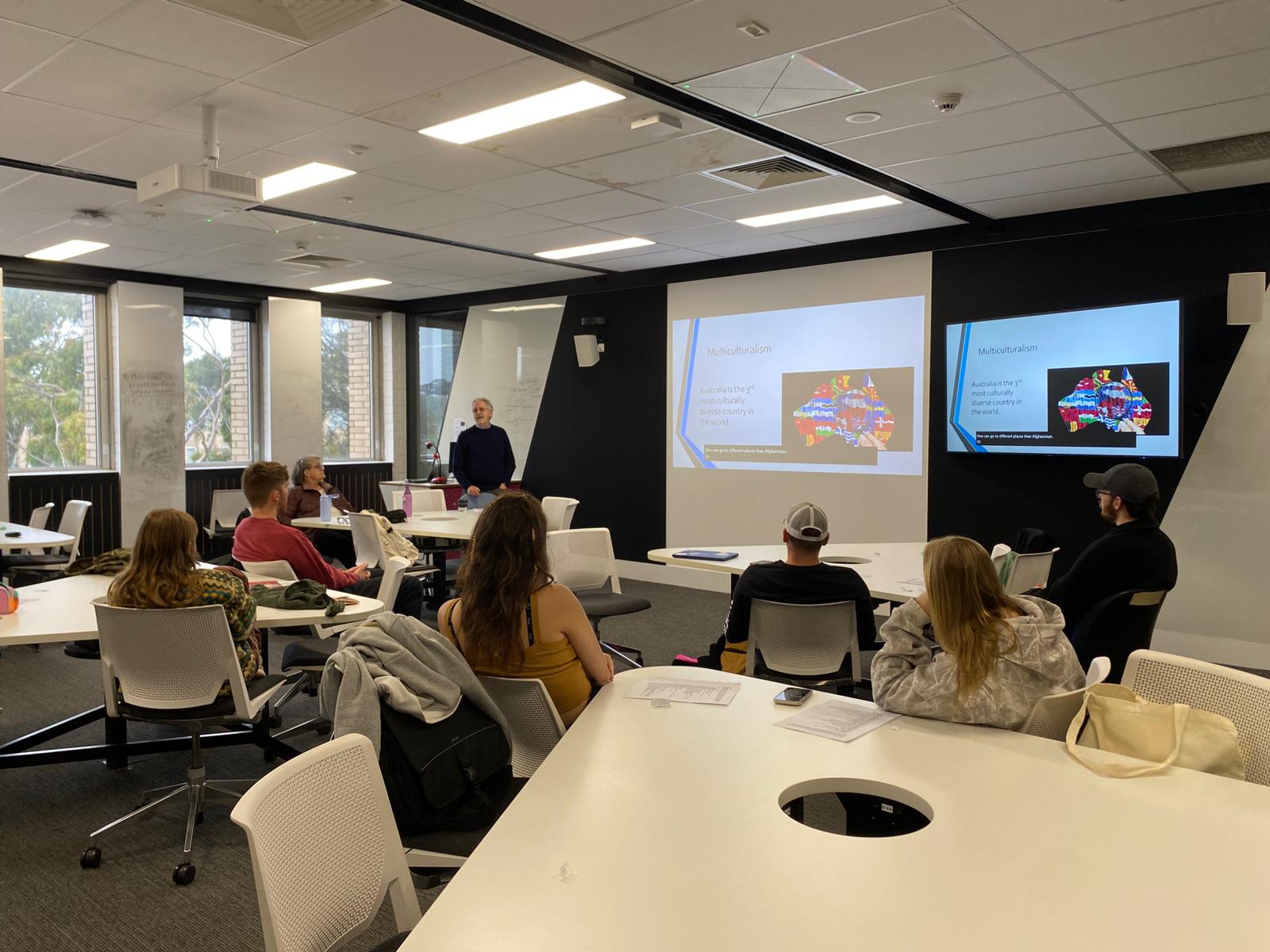 Students in La Trobe classroom watching guest lecture on Australia