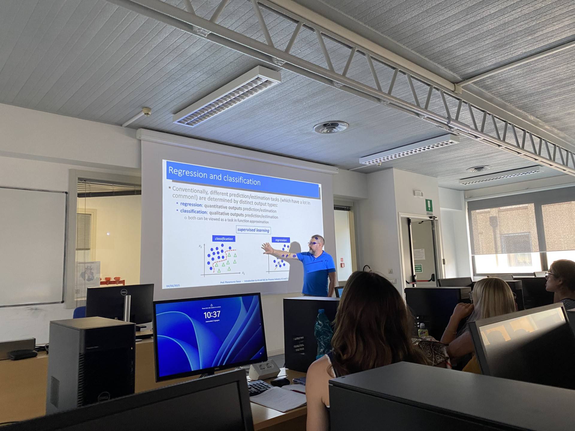 Students in classroom listening to guest lecture