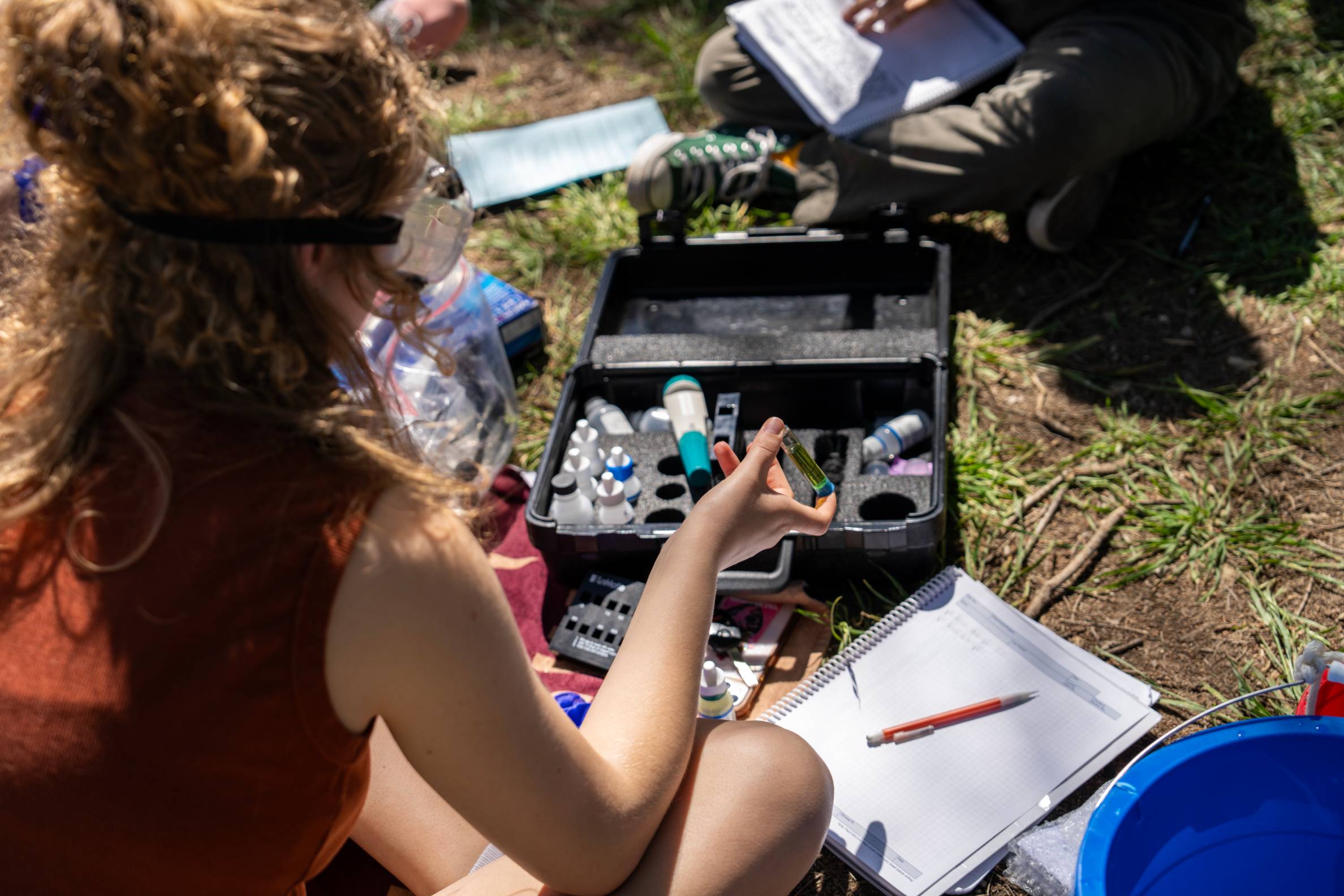 Students using gear to perform tests.