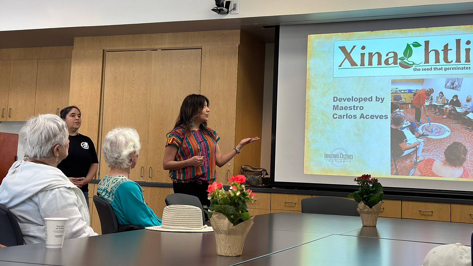Yvette Regalado presents on her dissertation.