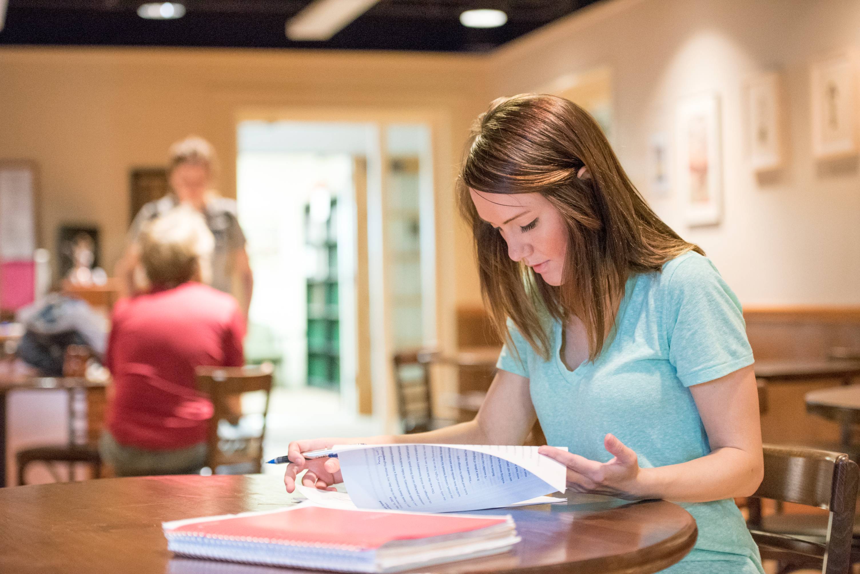 Student reviewing revisions on paper.