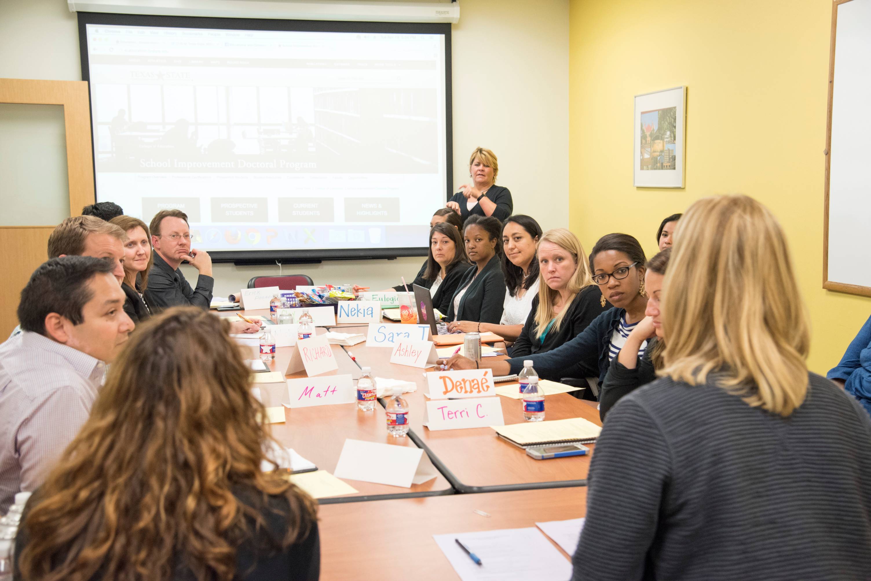 People gathered around a table for a meeting. 