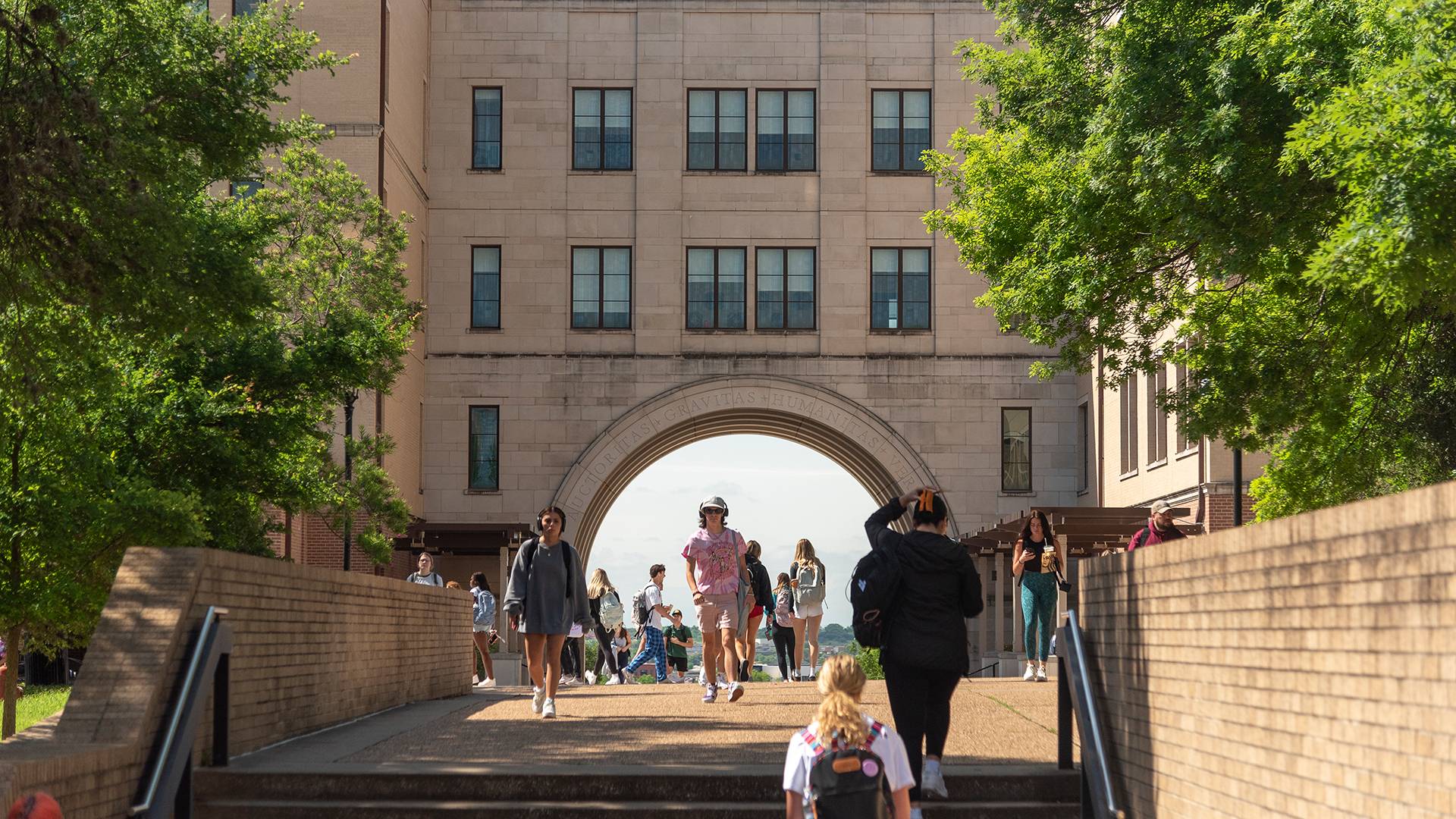 students walking on a college campus