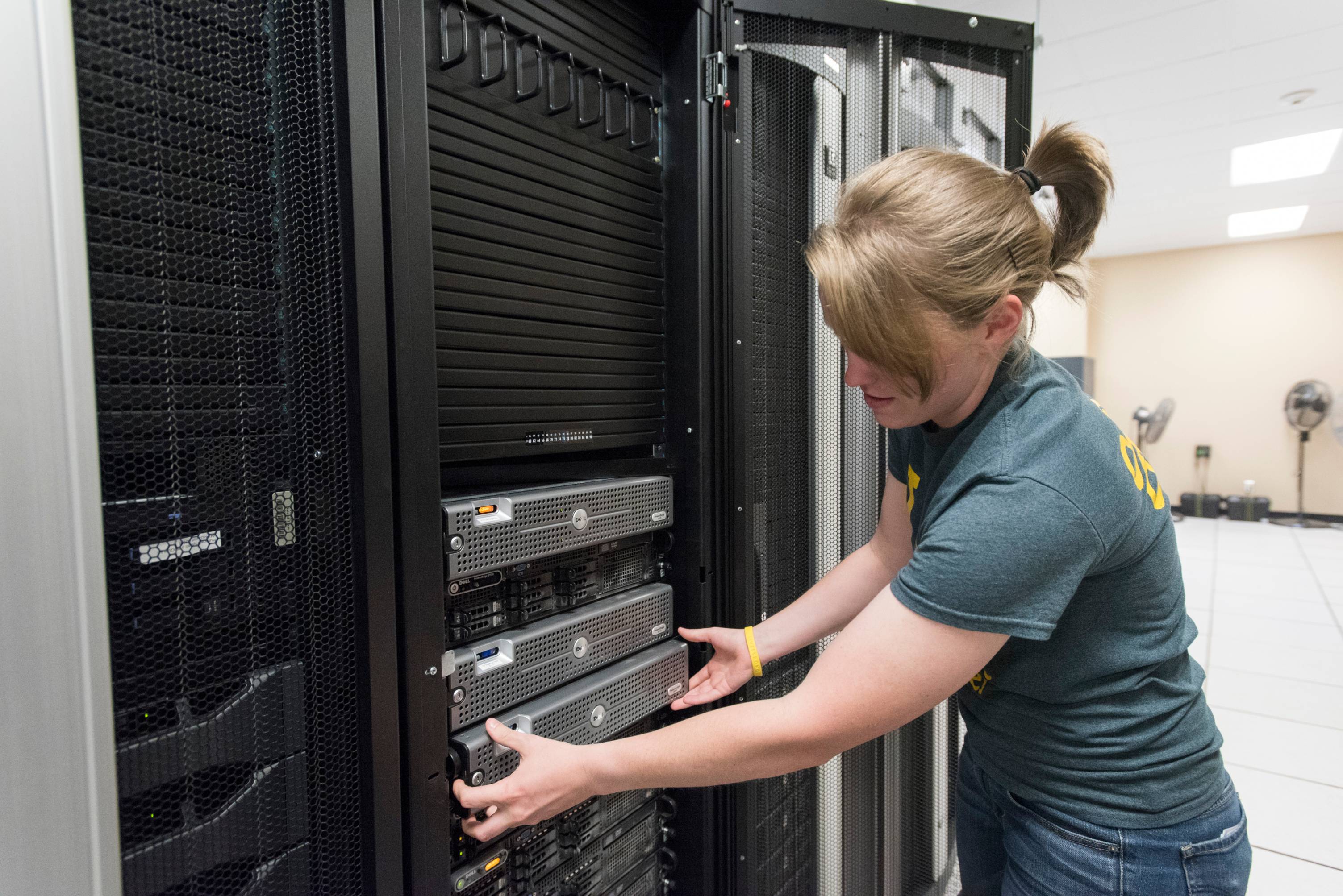 Person working on a main computer.