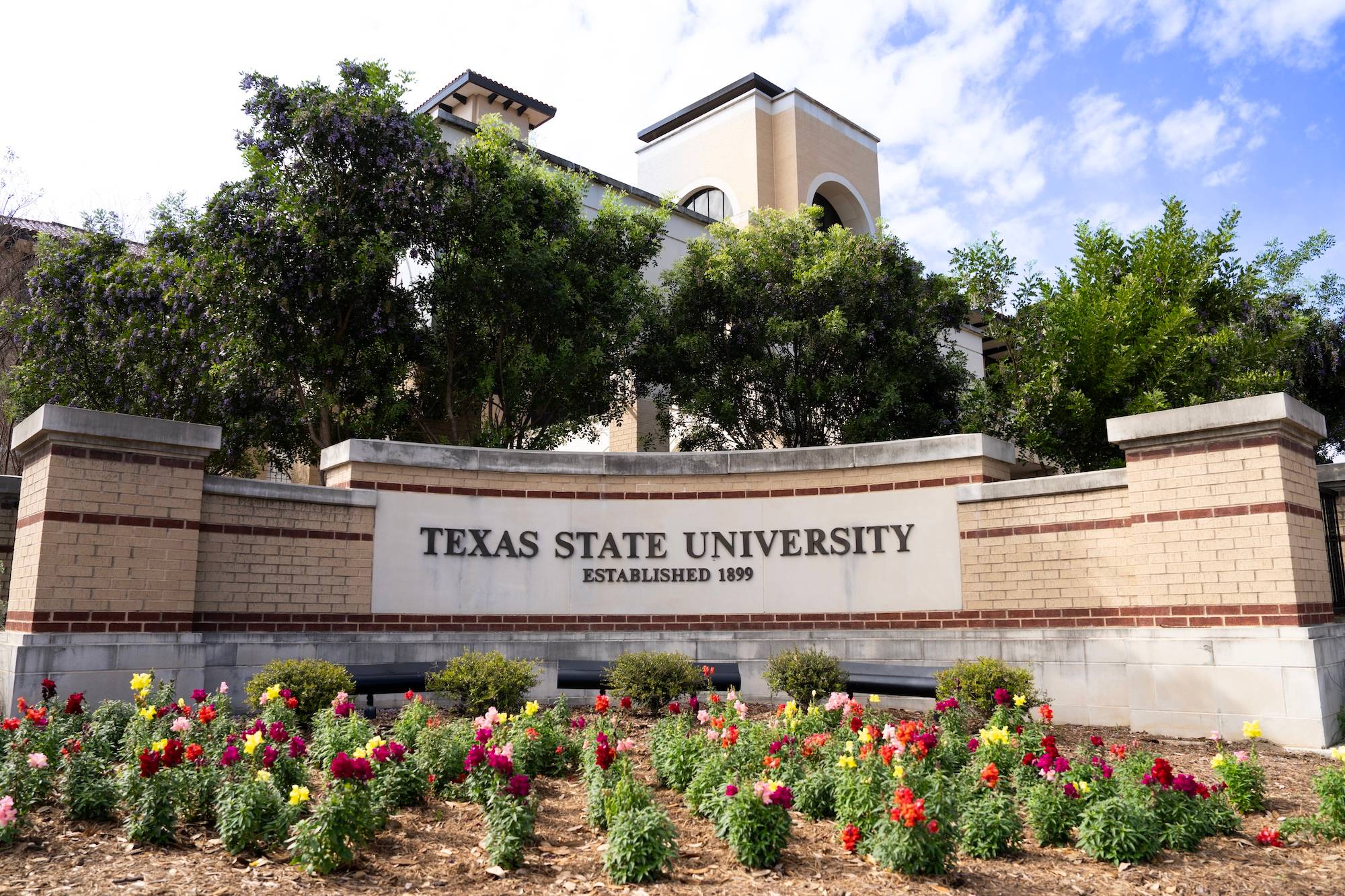 Texas State sign and garden on the San Marcos campus