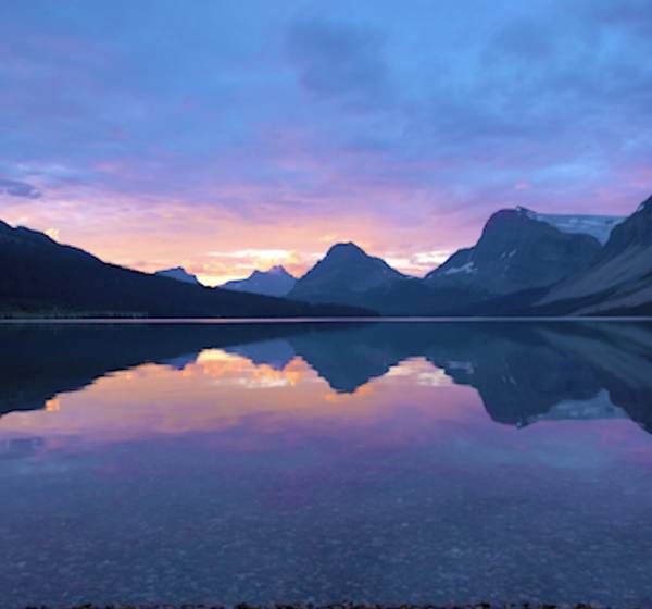 mountains and sunset with a water reflection