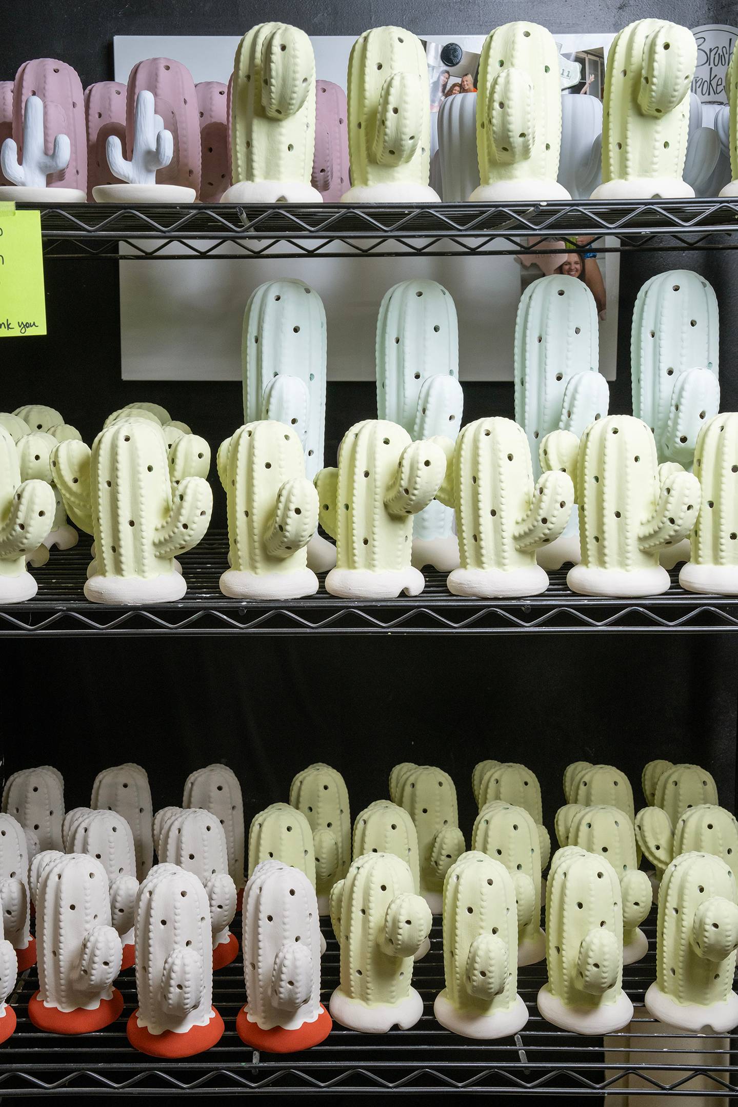 Rows of ceramic cacti waiting to go in the kiln.
