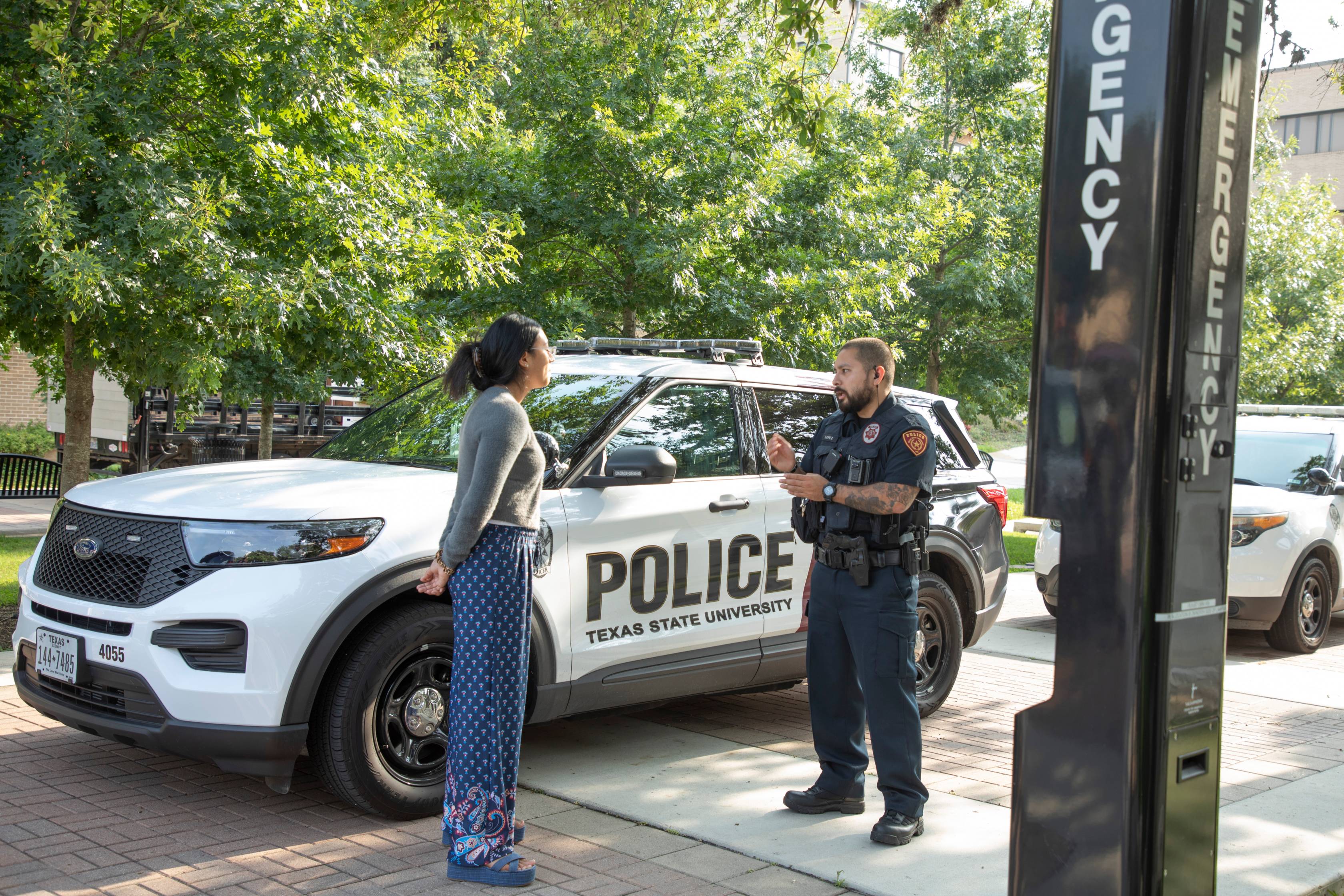graduates sitting in a commencement chair