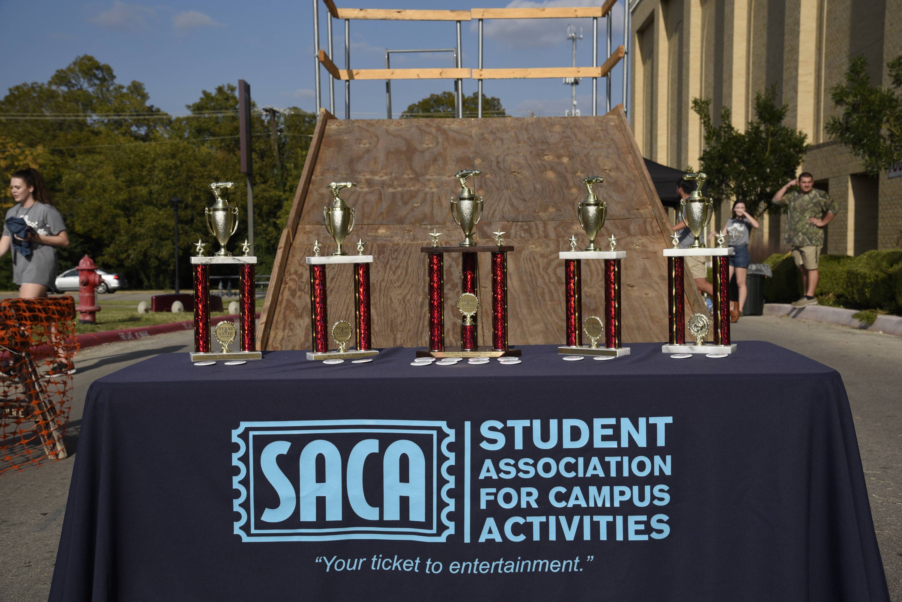 Image of a SACA table with trophies on it.