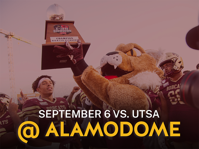 Boko the Bobcat holding the 1-35 Showdown trophy with text reading September 6 vs. UTSA, at UTSA