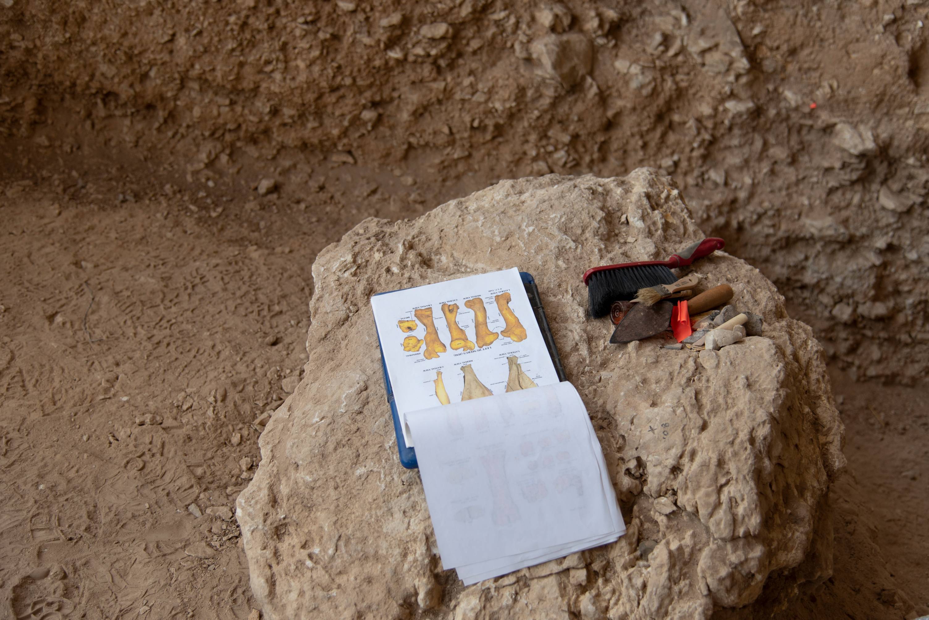 Field work in a cave with tools. 