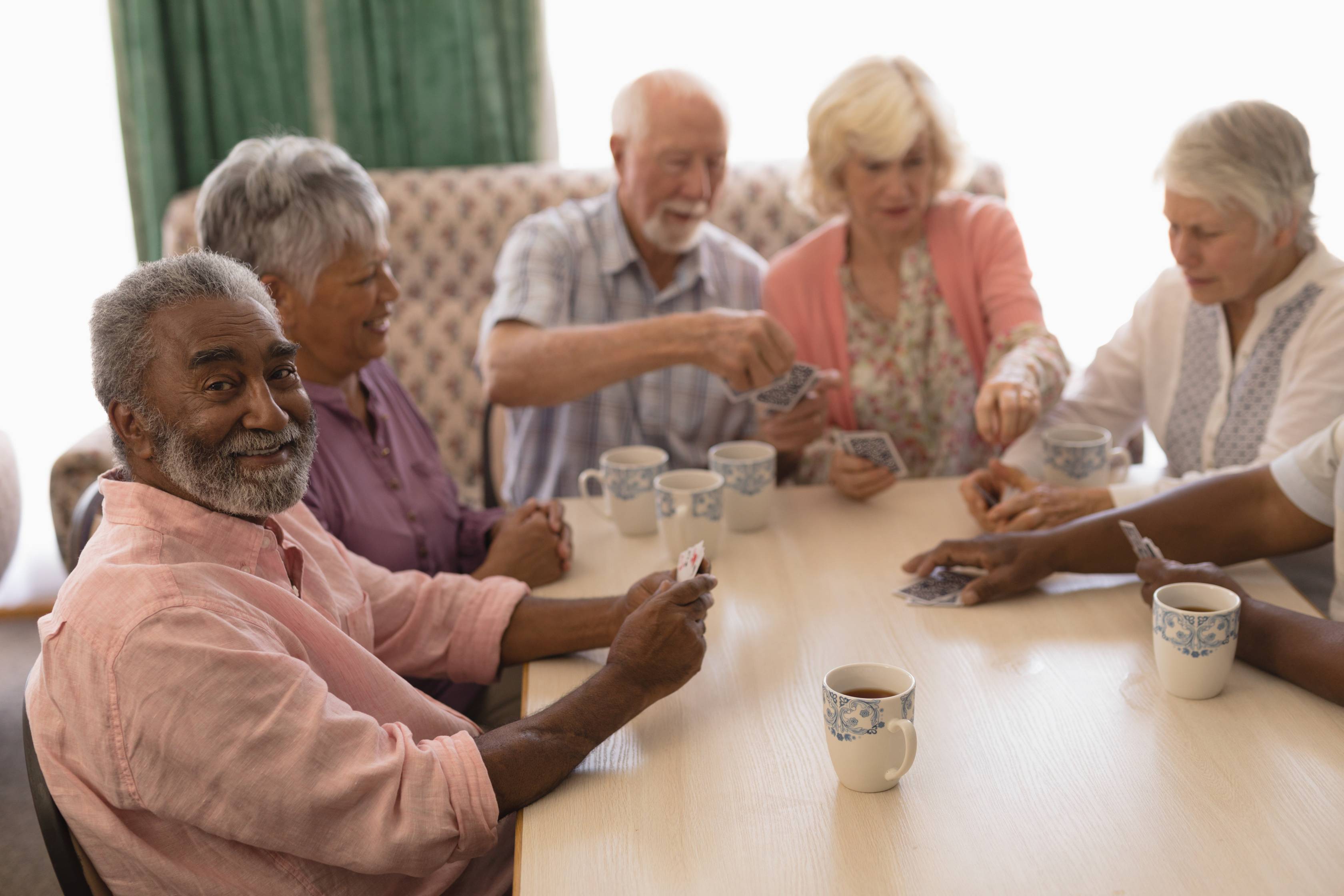 Group of people sitting at a table having a discussion
