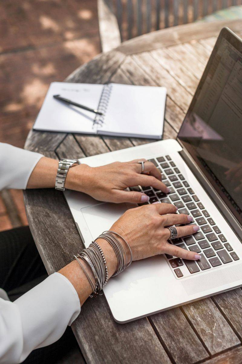 Woman typing on computer