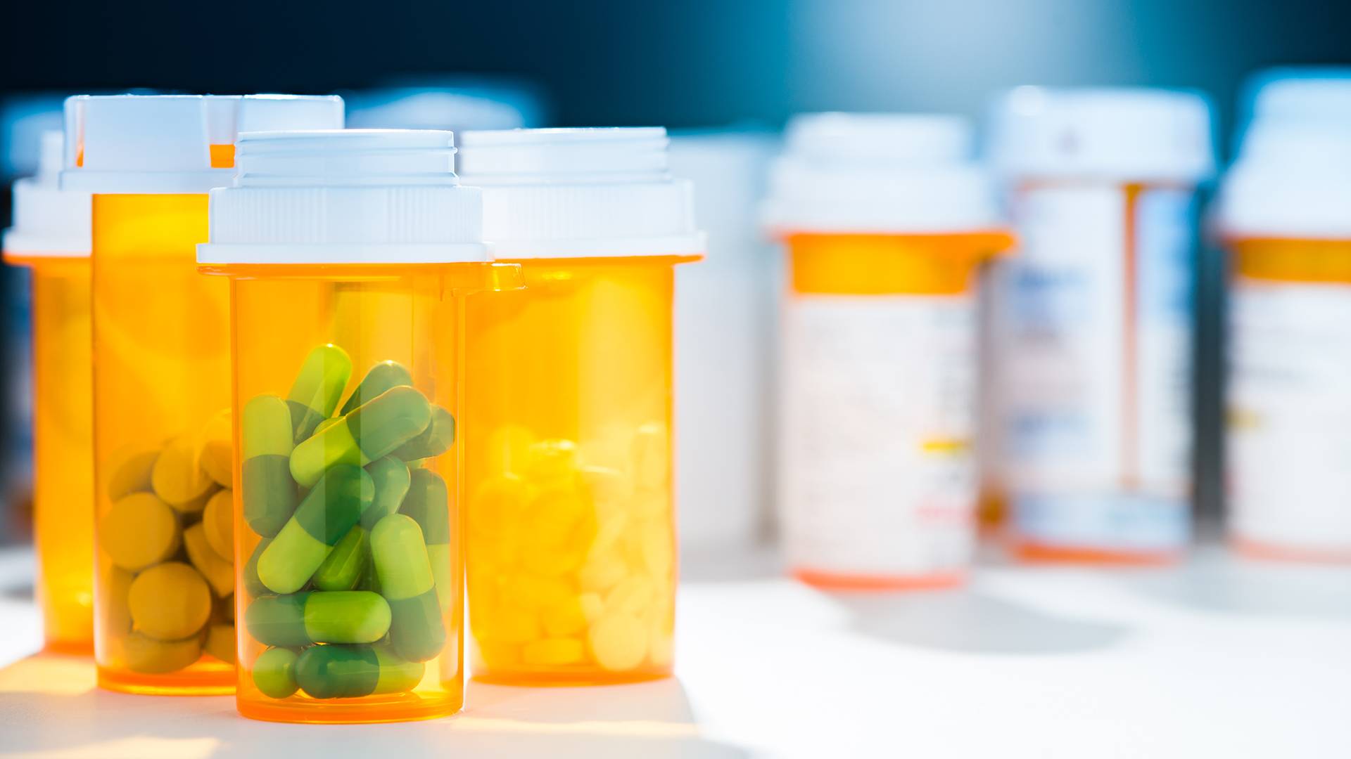prescription medication bottles sitting on a table