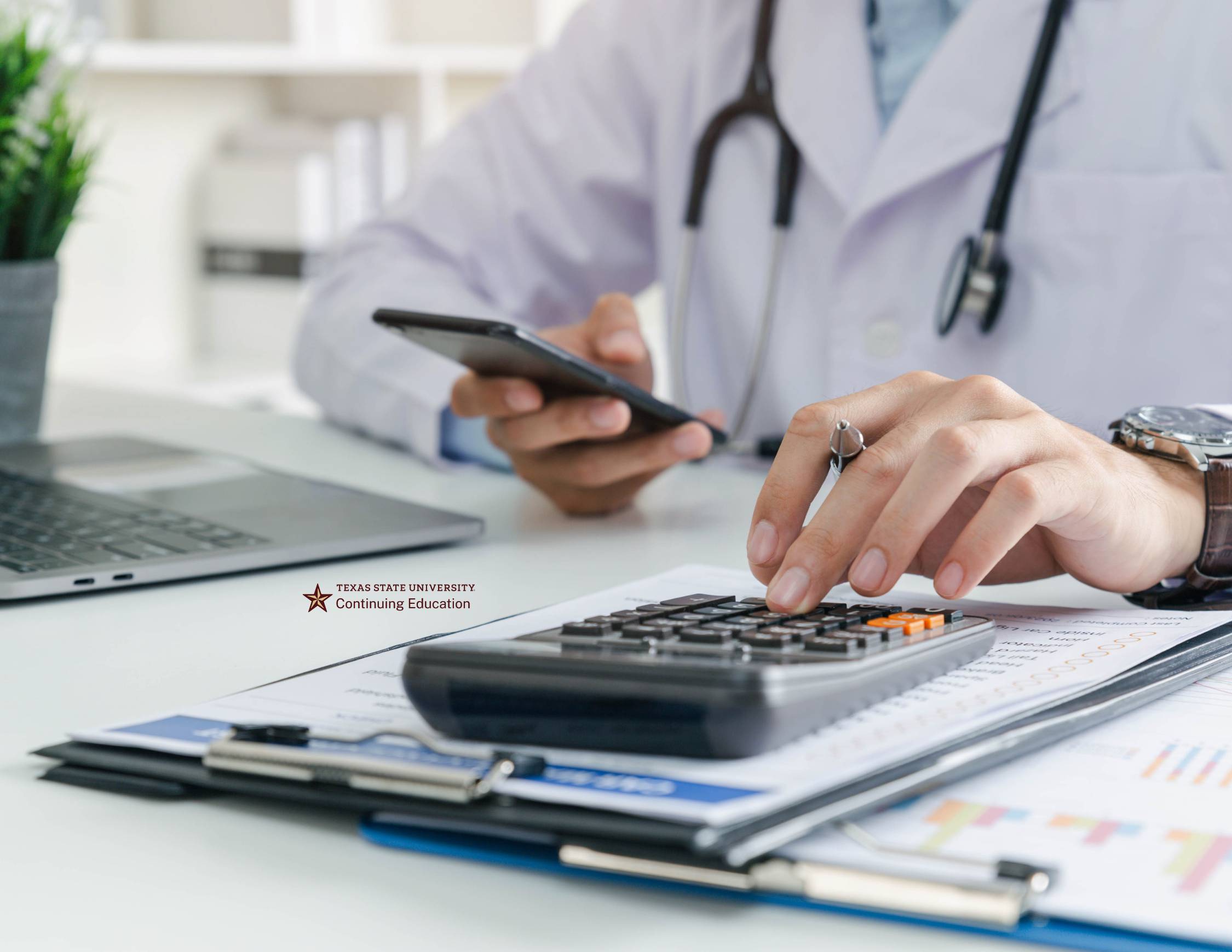 doctor typing on calculator and looking at phone