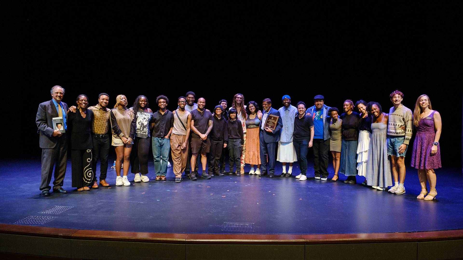 a group of actors standing on a stage