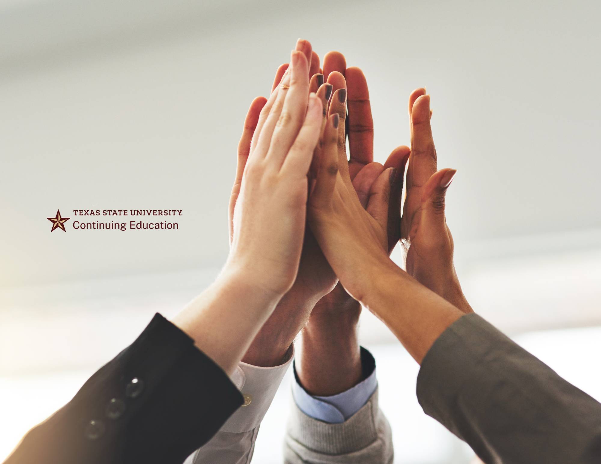 several people high-fiving