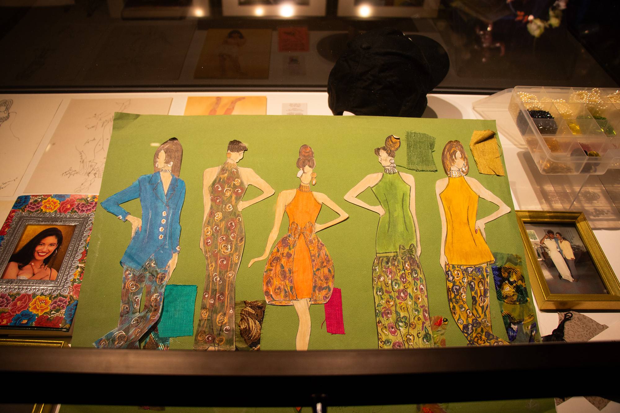 photos and a painting on display at a museum