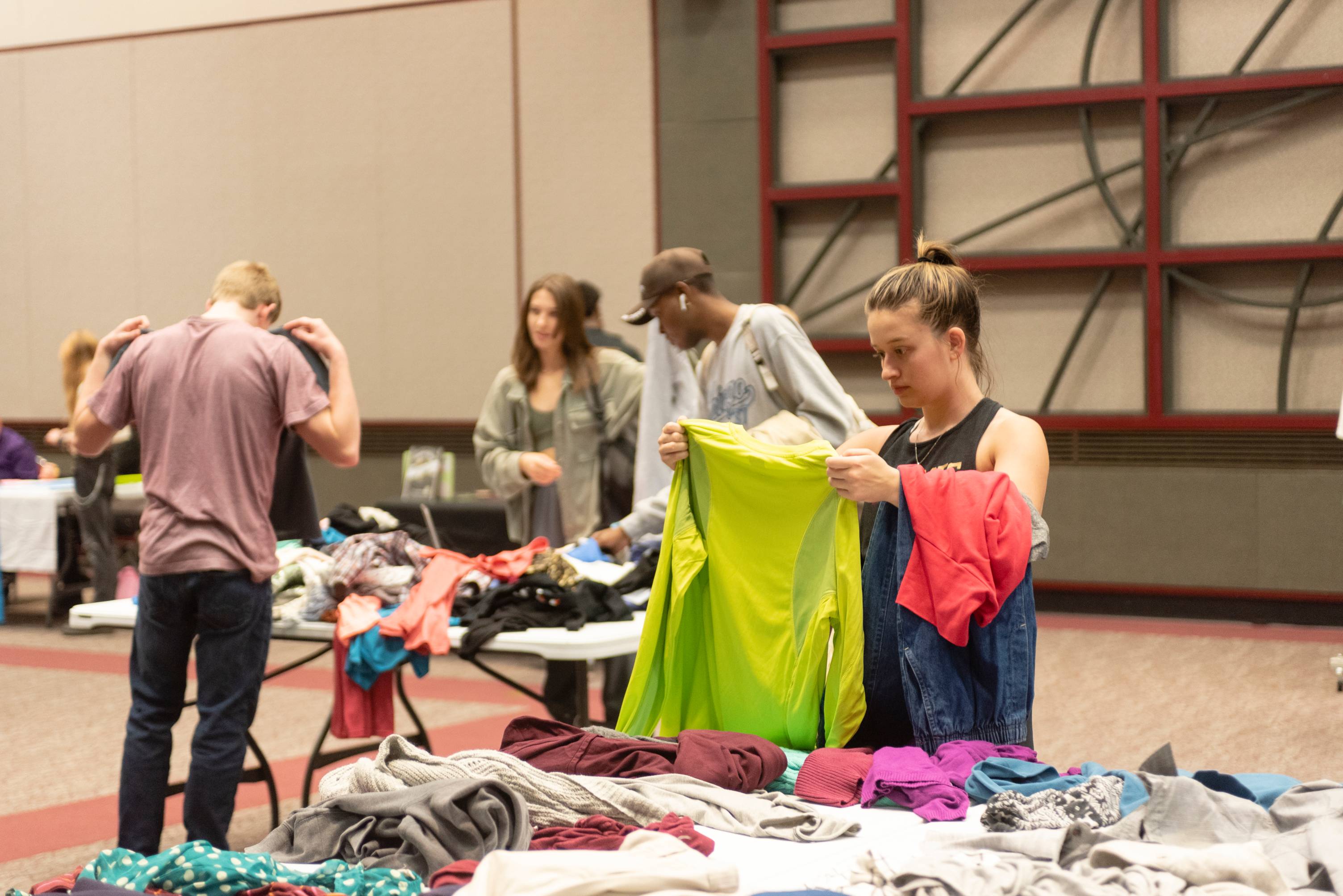 students searching through clothing 