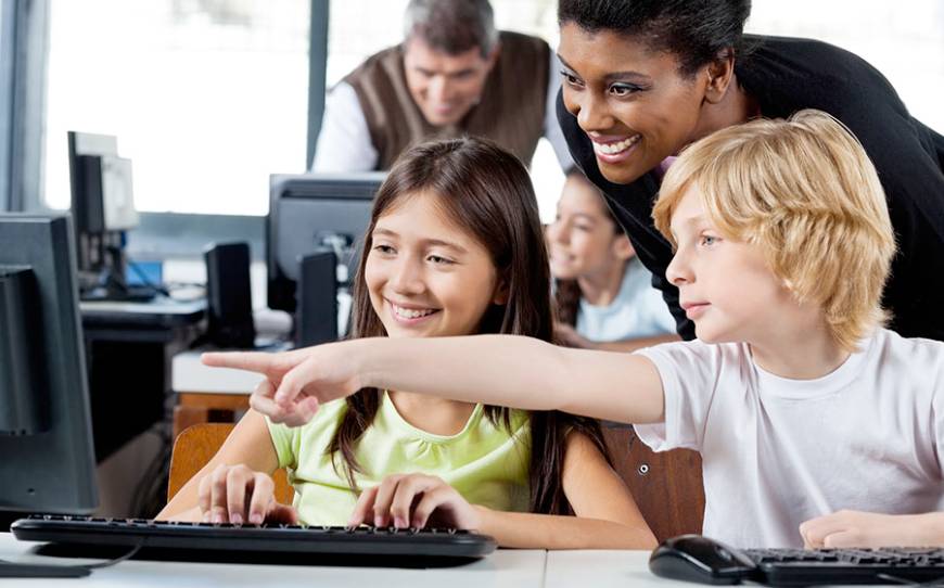a teacher guiding children in learning AI