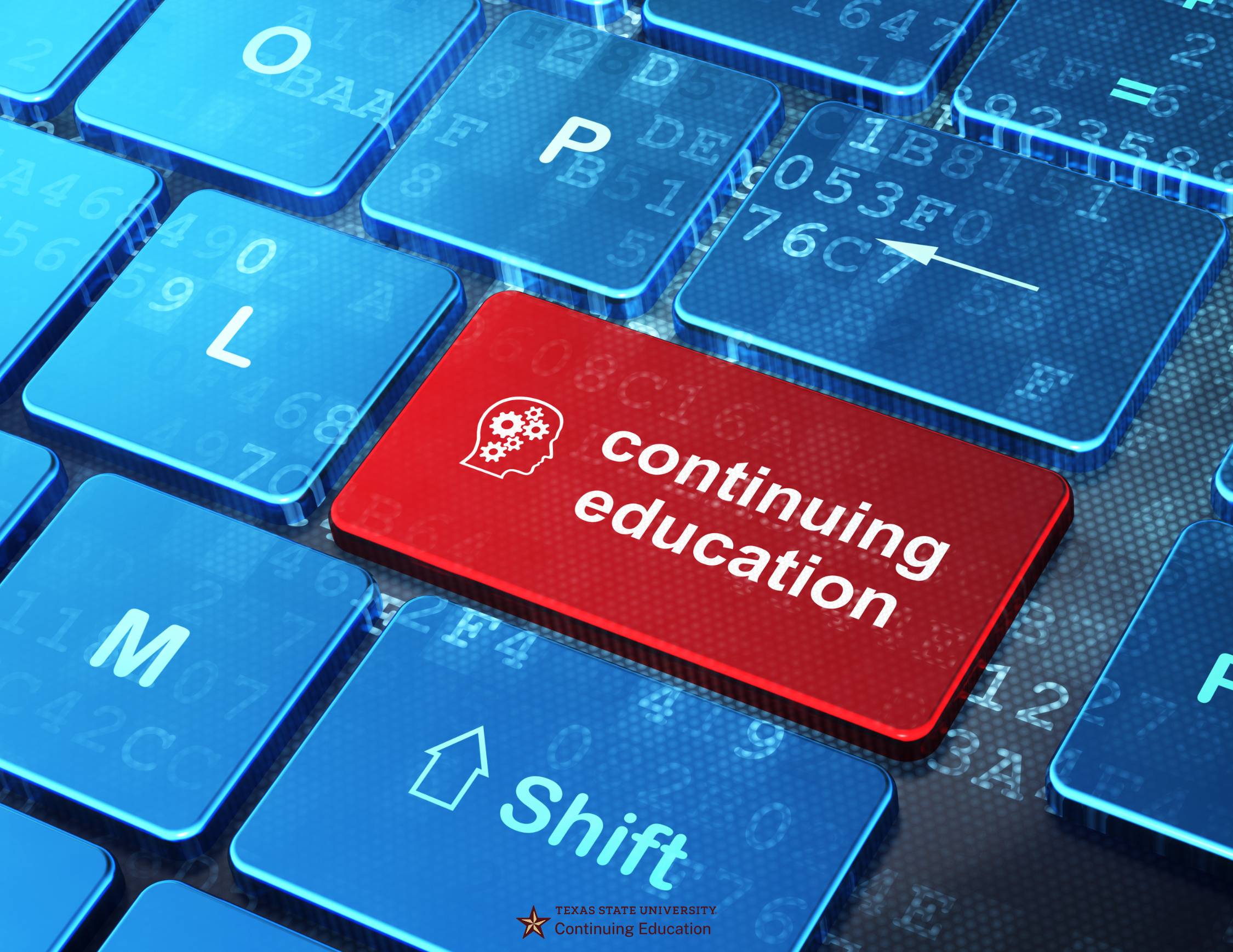 blue keyboard with one red key with continuing education printed on it in white text